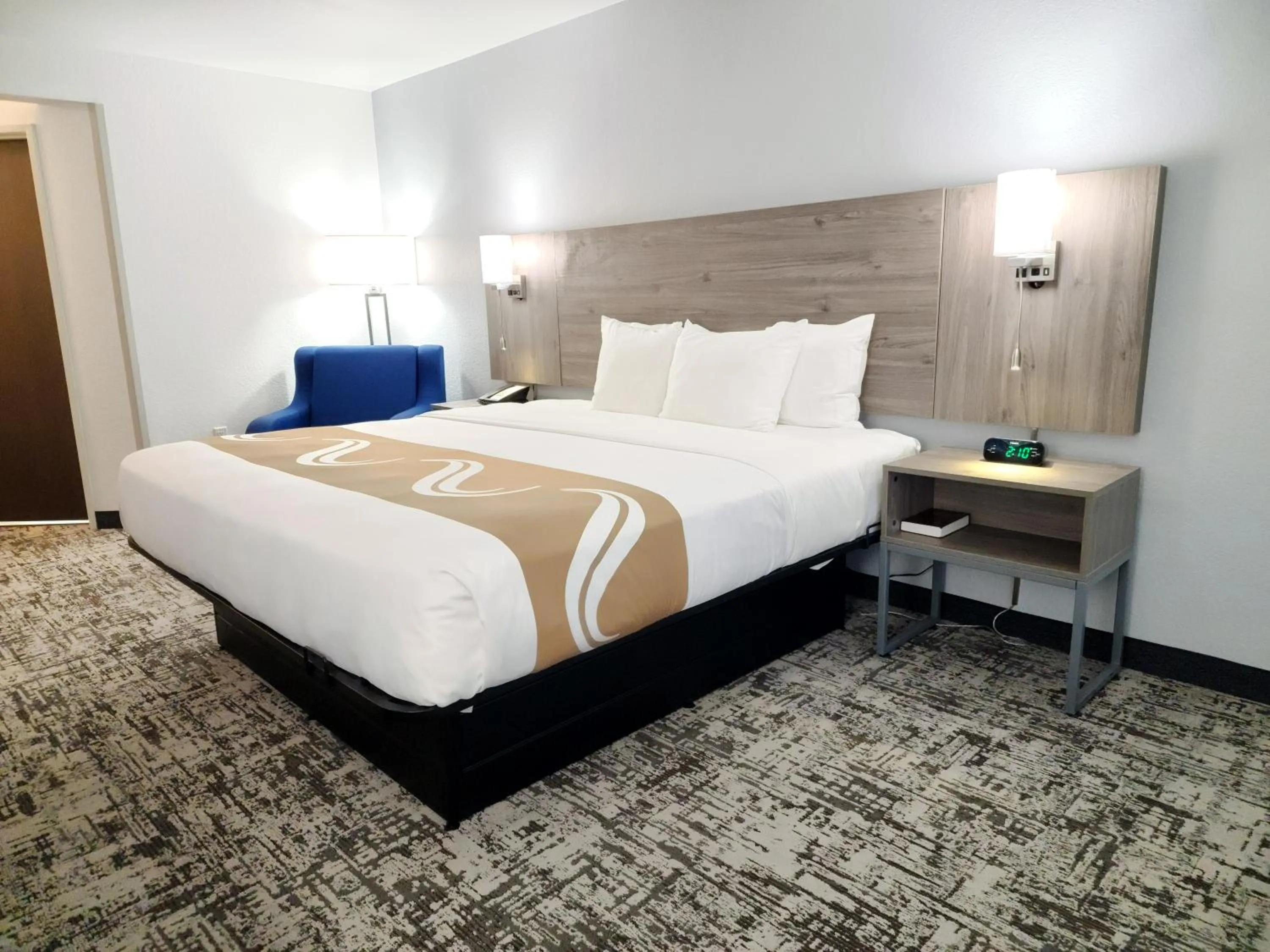 Bed in Quality Inn & Suites Denver International Airport