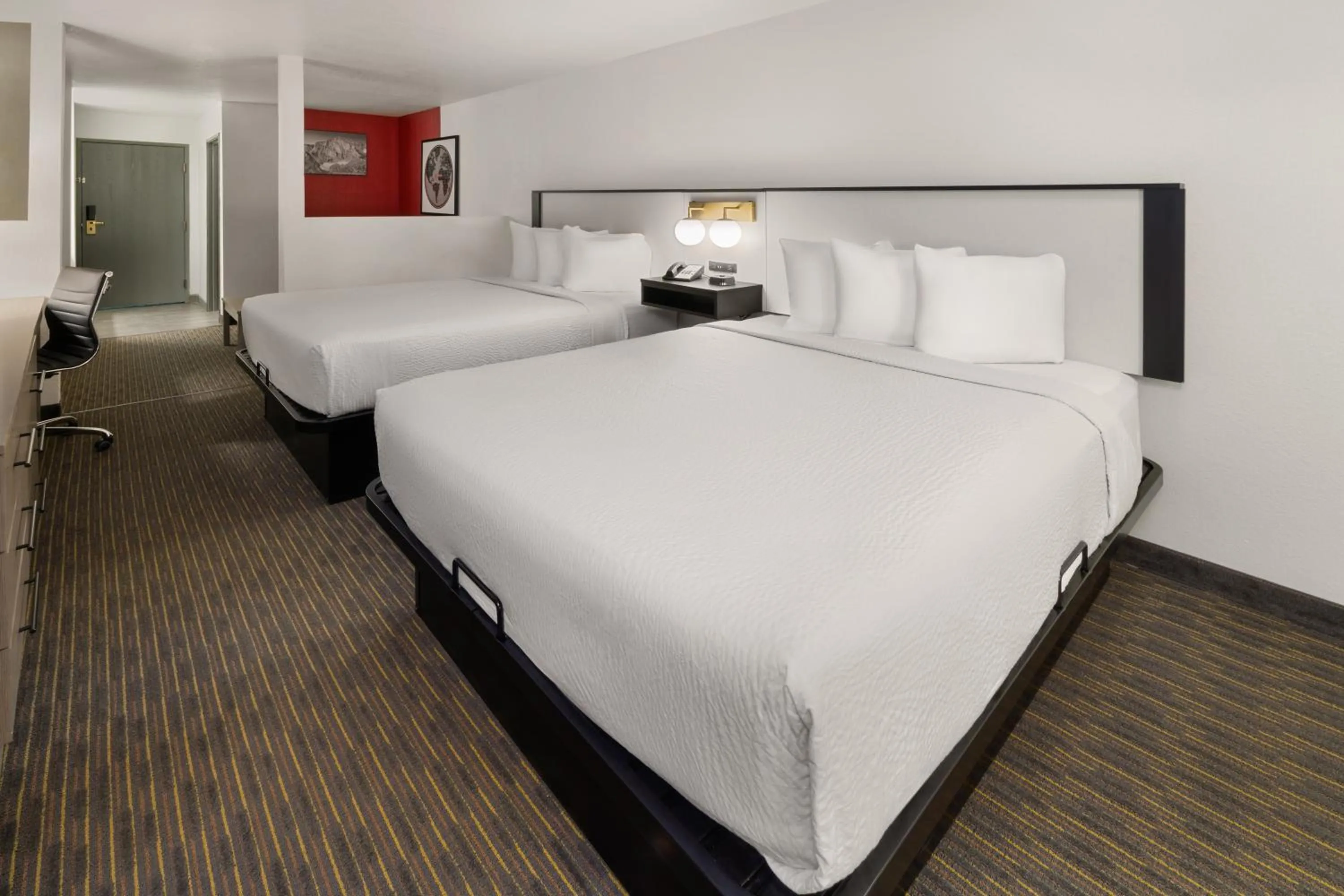 Bed in SYLO Hotel Denver Airport, a Ramada by Wyndham