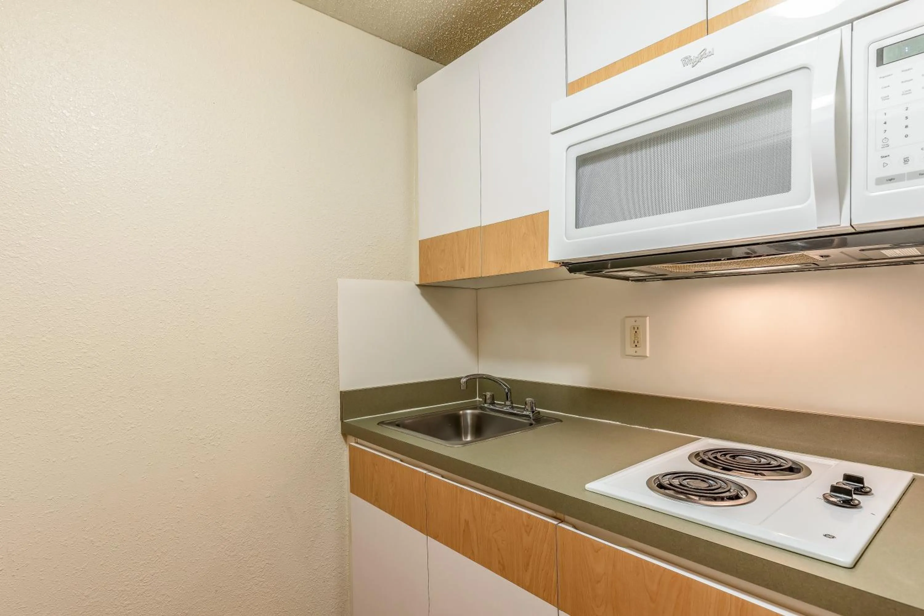 Photo of the whole room in HomeTowne Studios by Red Roof Orlando - Casselberry