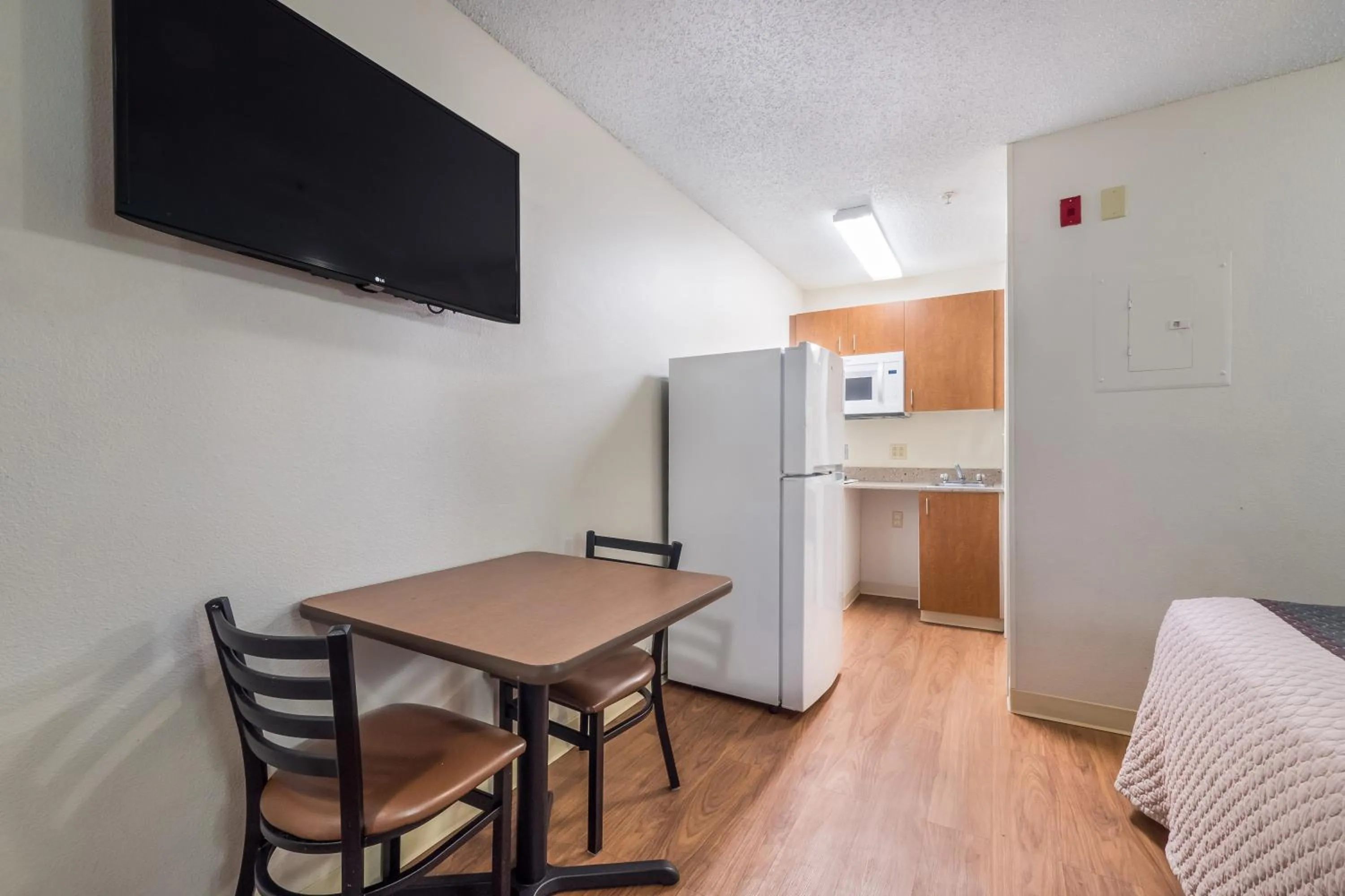 Photo of the whole room in HomeTowne Studios by Red Roof Orlando South