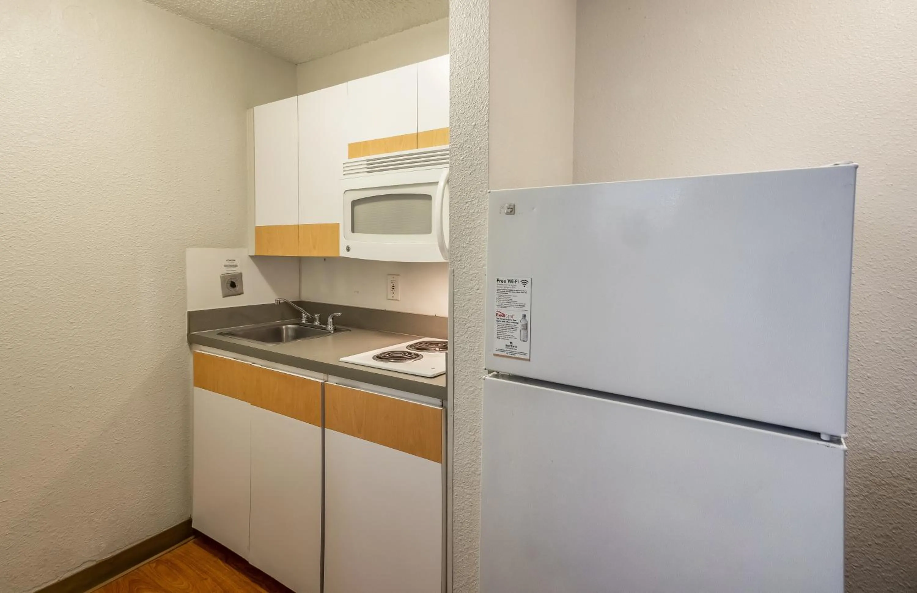 Photo of the whole room in HomeTowne Studios by Red Roof Orlando South