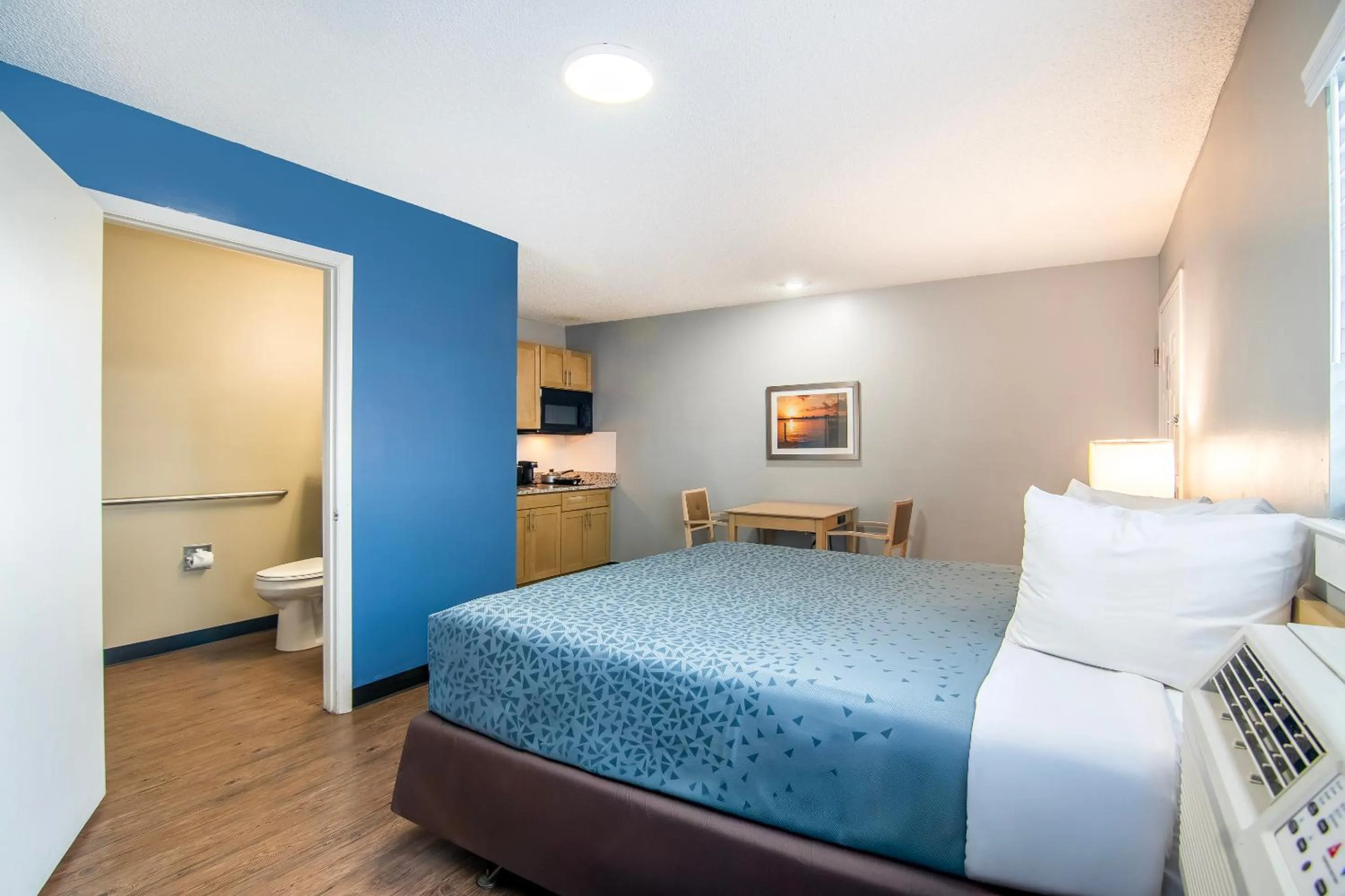 Bedroom, Bed in Suburban Studios Stuart near Federal Hwy 1