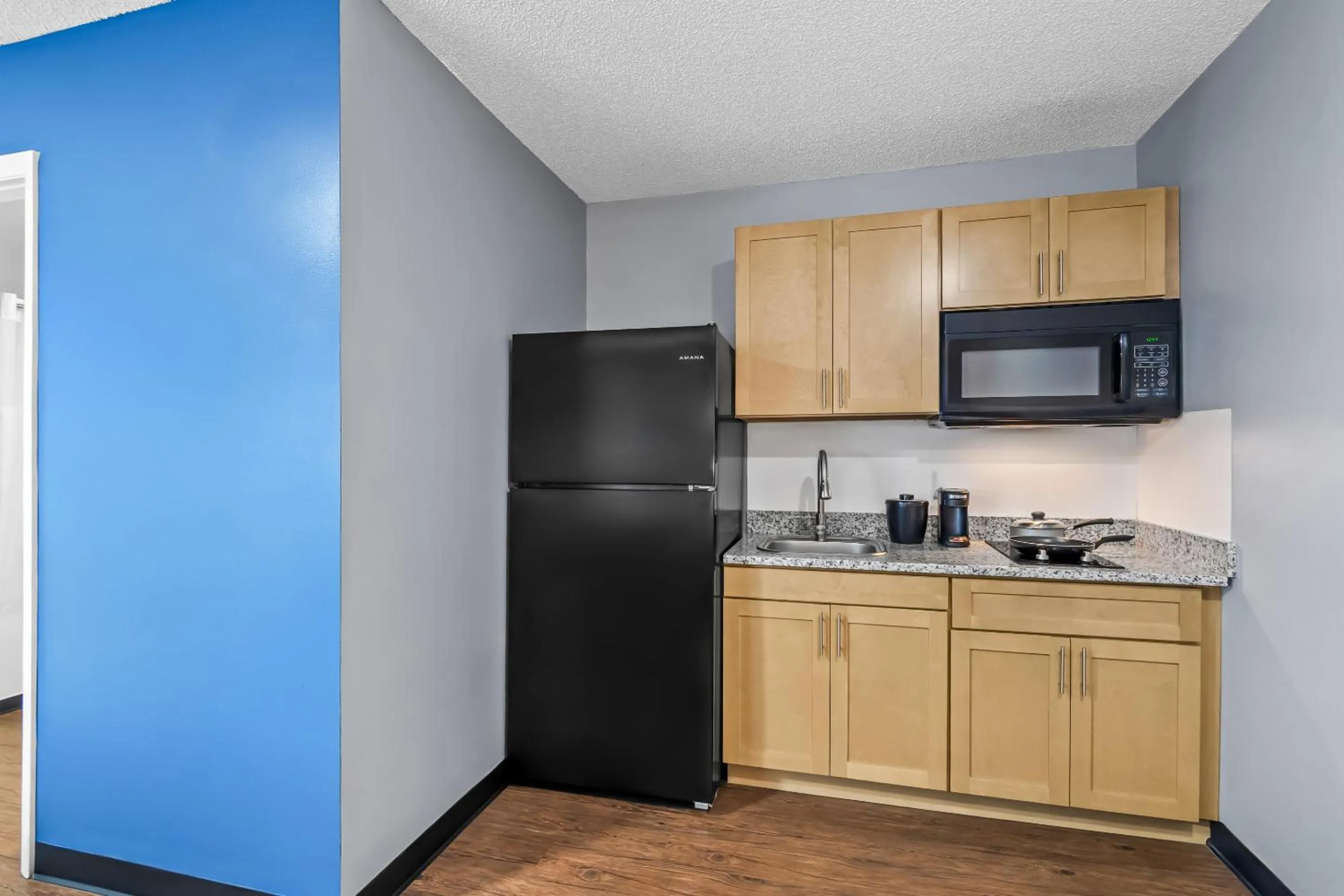 Kitchen or kitchenette in Suburban Studios Stuart near Federal Hwy 1