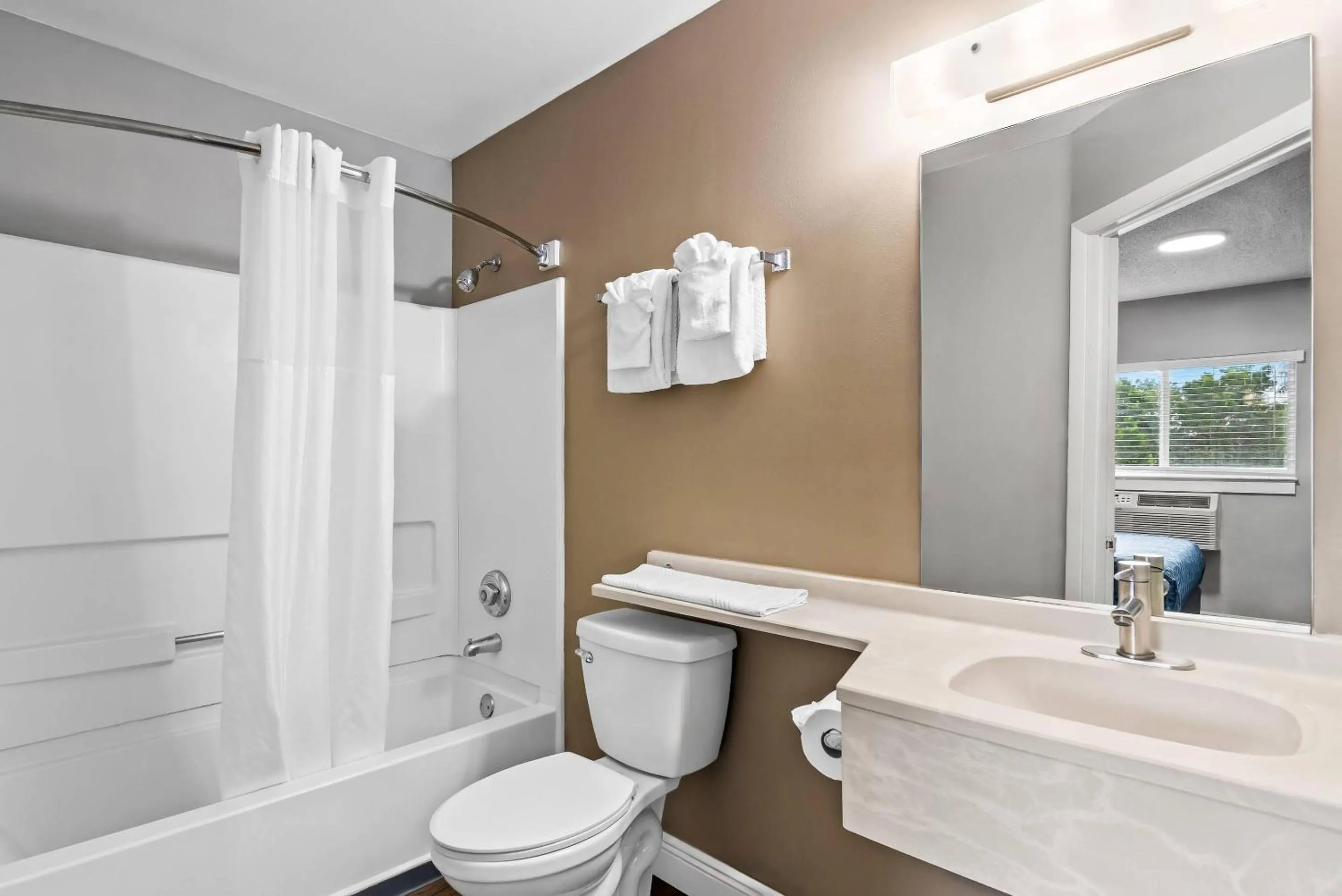 Bedroom in Suburban Studios Stuart near Federal Hwy 1