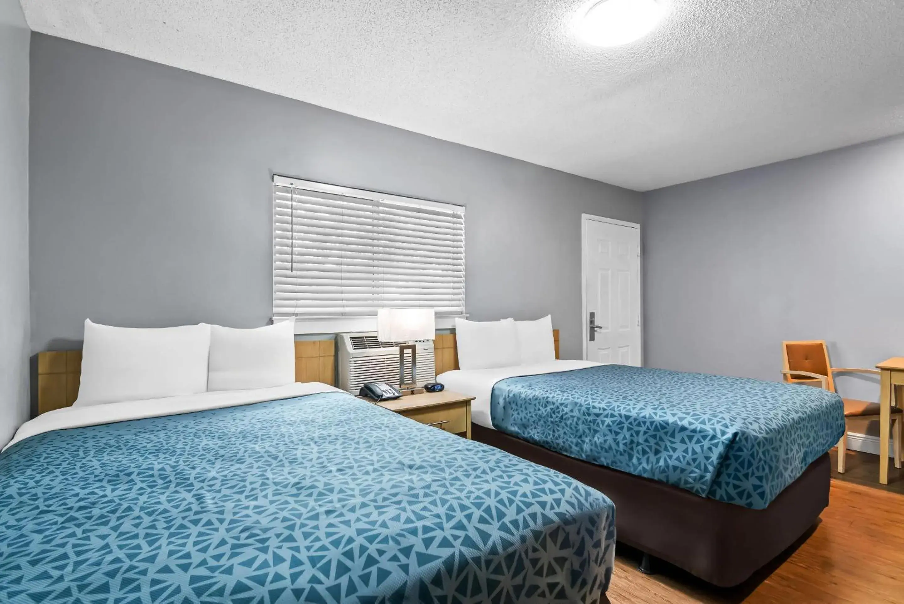 Bedroom, Bed in Suburban Studios Stuart near Federal Hwy 1 Bedroom, Bed in Suburban Studios Stuart near Federal Hwy 1