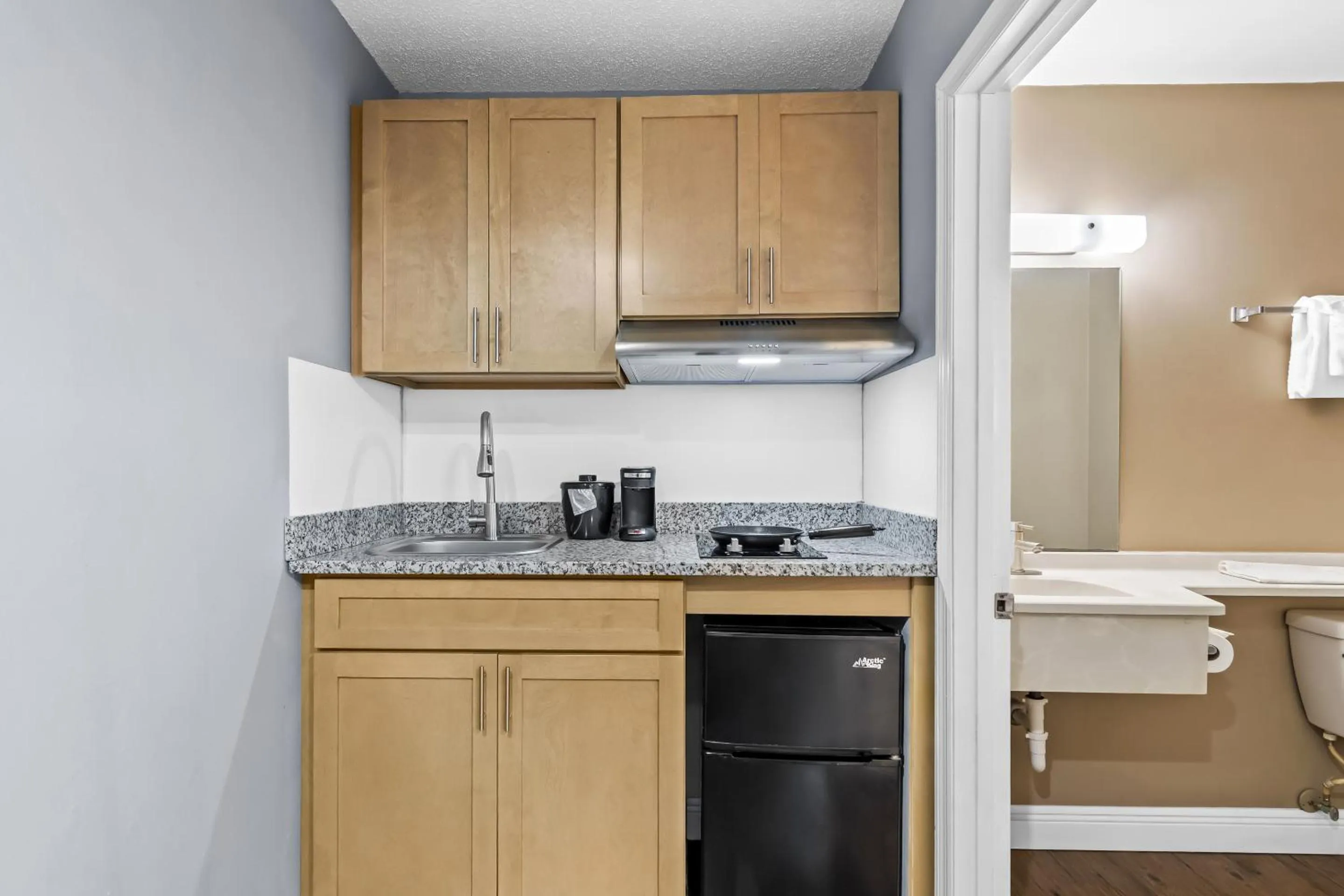 Kitchen or kitchenette in Suburban Studios Stuart near Federal Hwy 1