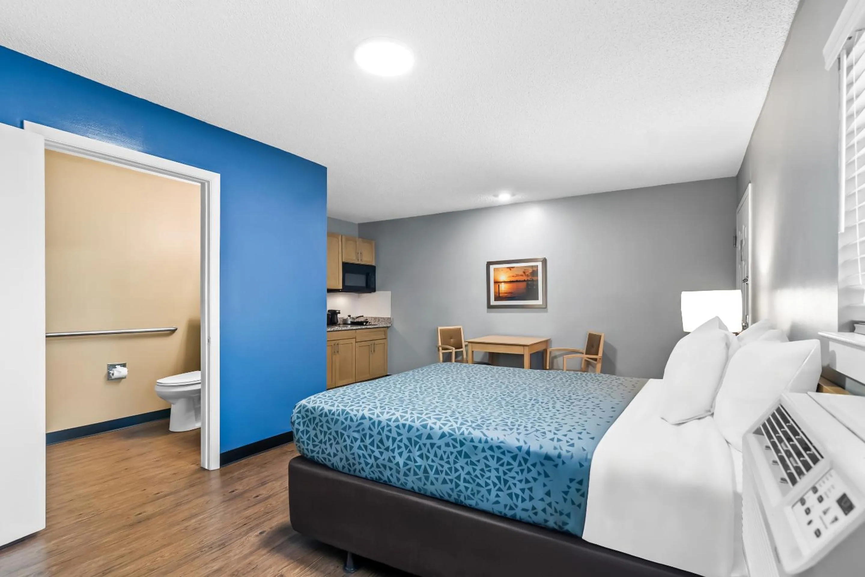 Bedroom, Bed in Suburban Studios Stuart near Federal Hwy 1