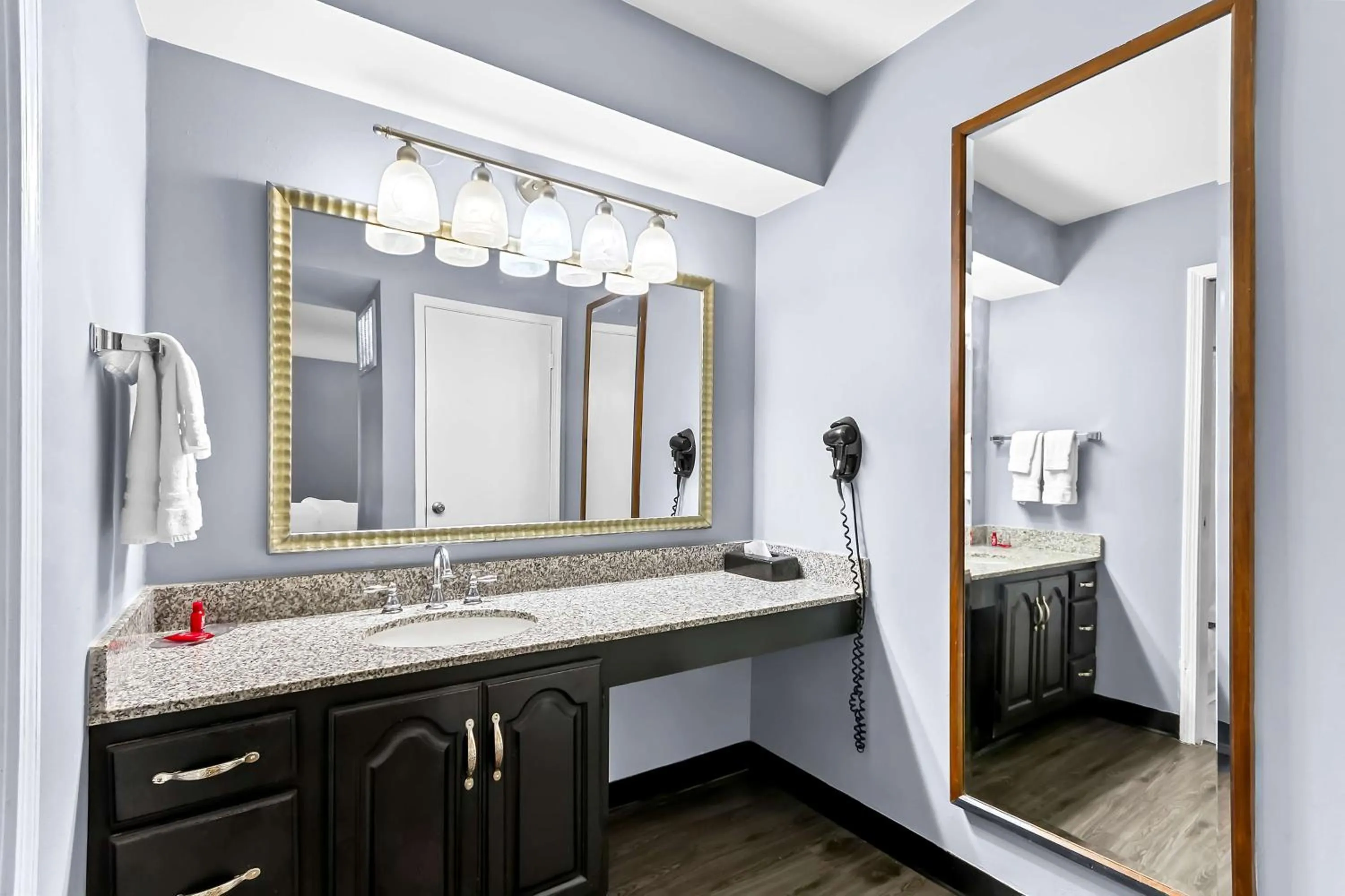 Bathroom in SureStay Studio by Best Western Pensacola