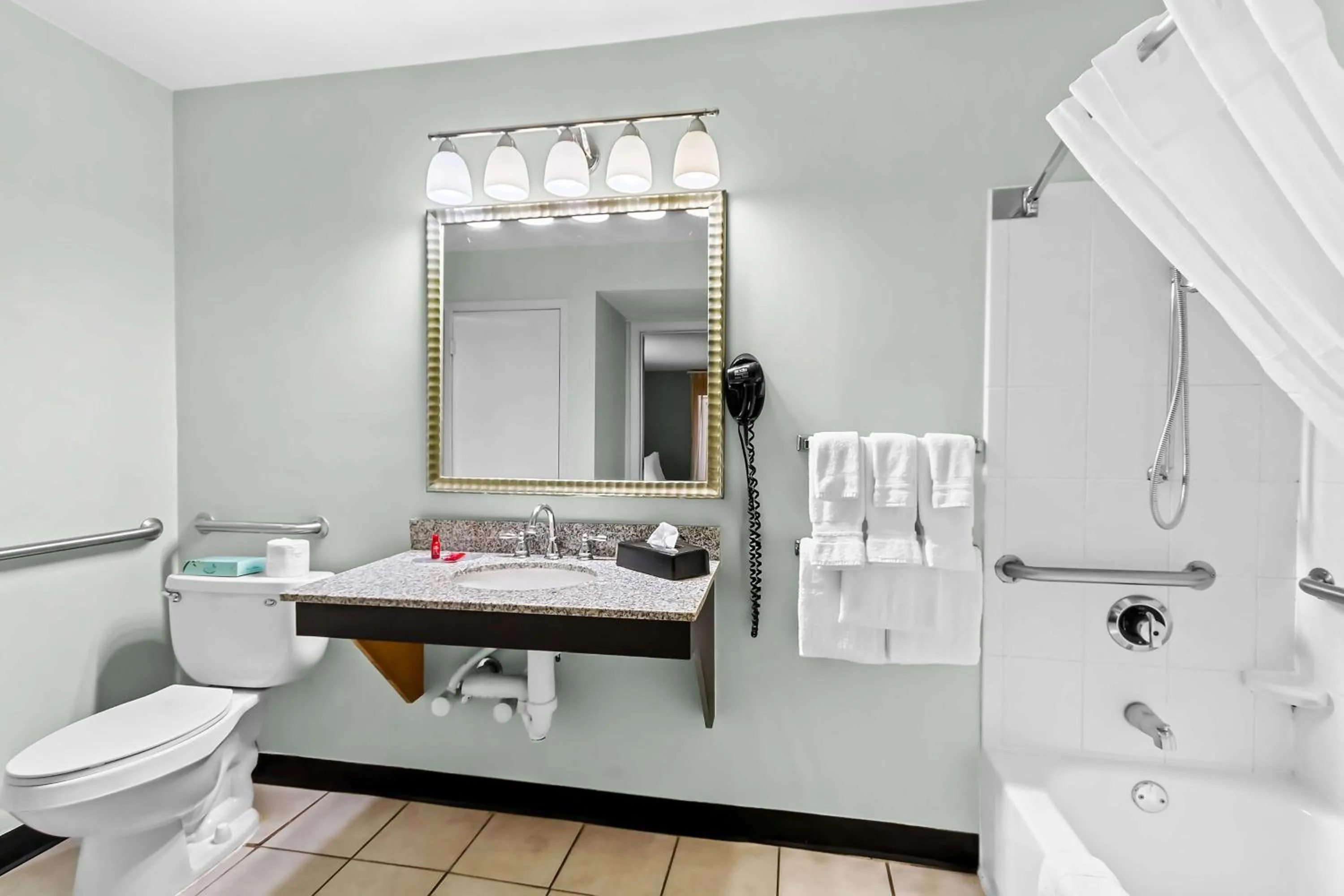 Bathroom in SureStay Studio by Best Western Pensacola