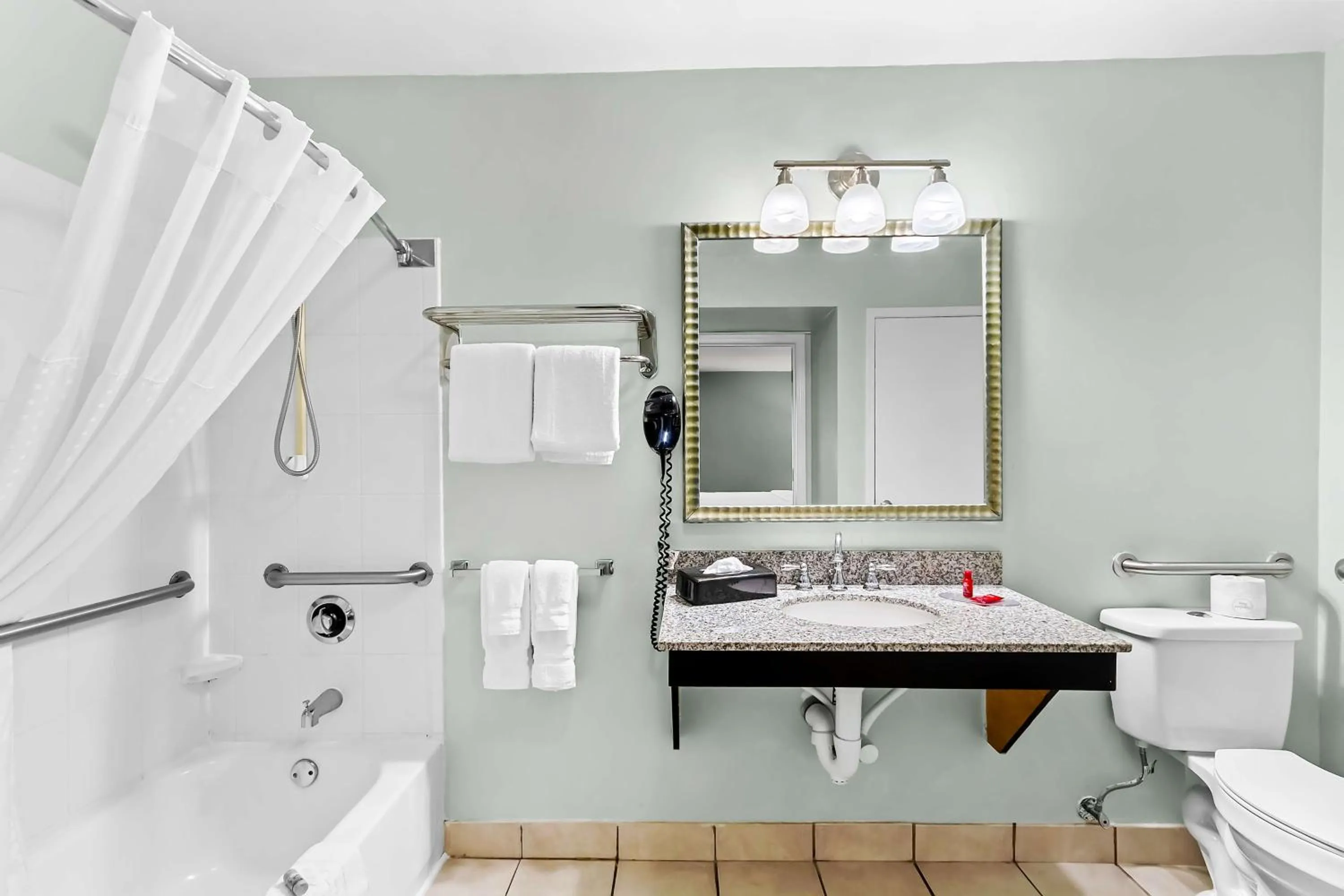 Bathroom in SureStay Studio by Best Western Pensacola