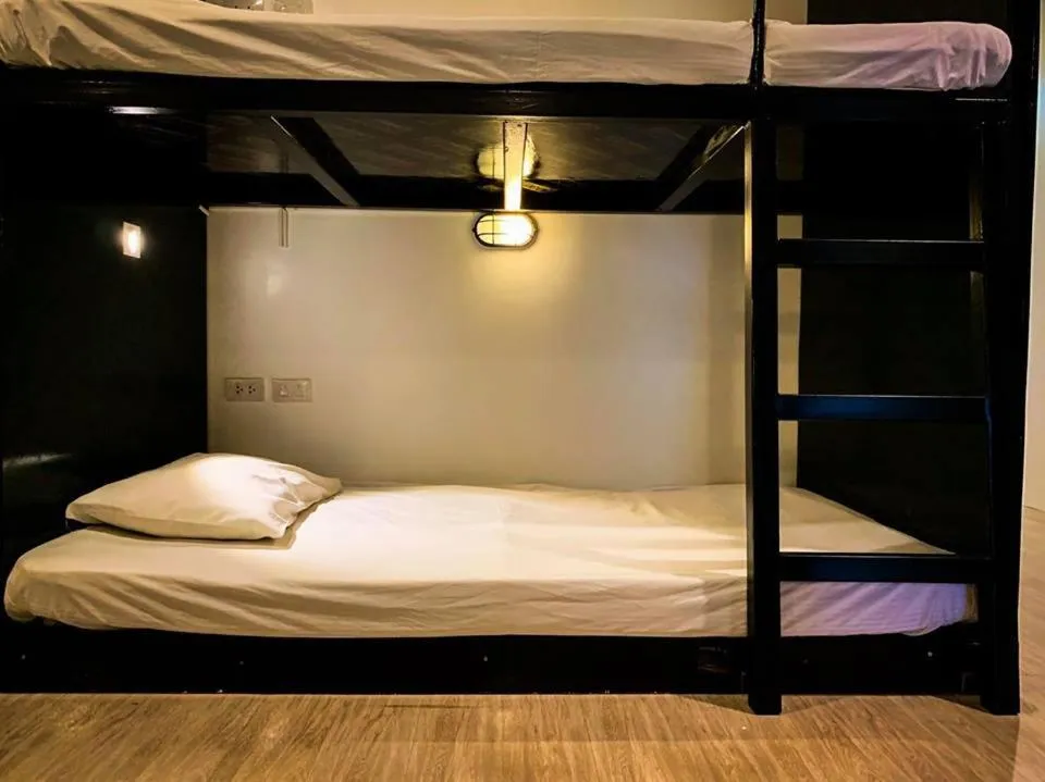 Bed in Coconut Grove Hotel Samui