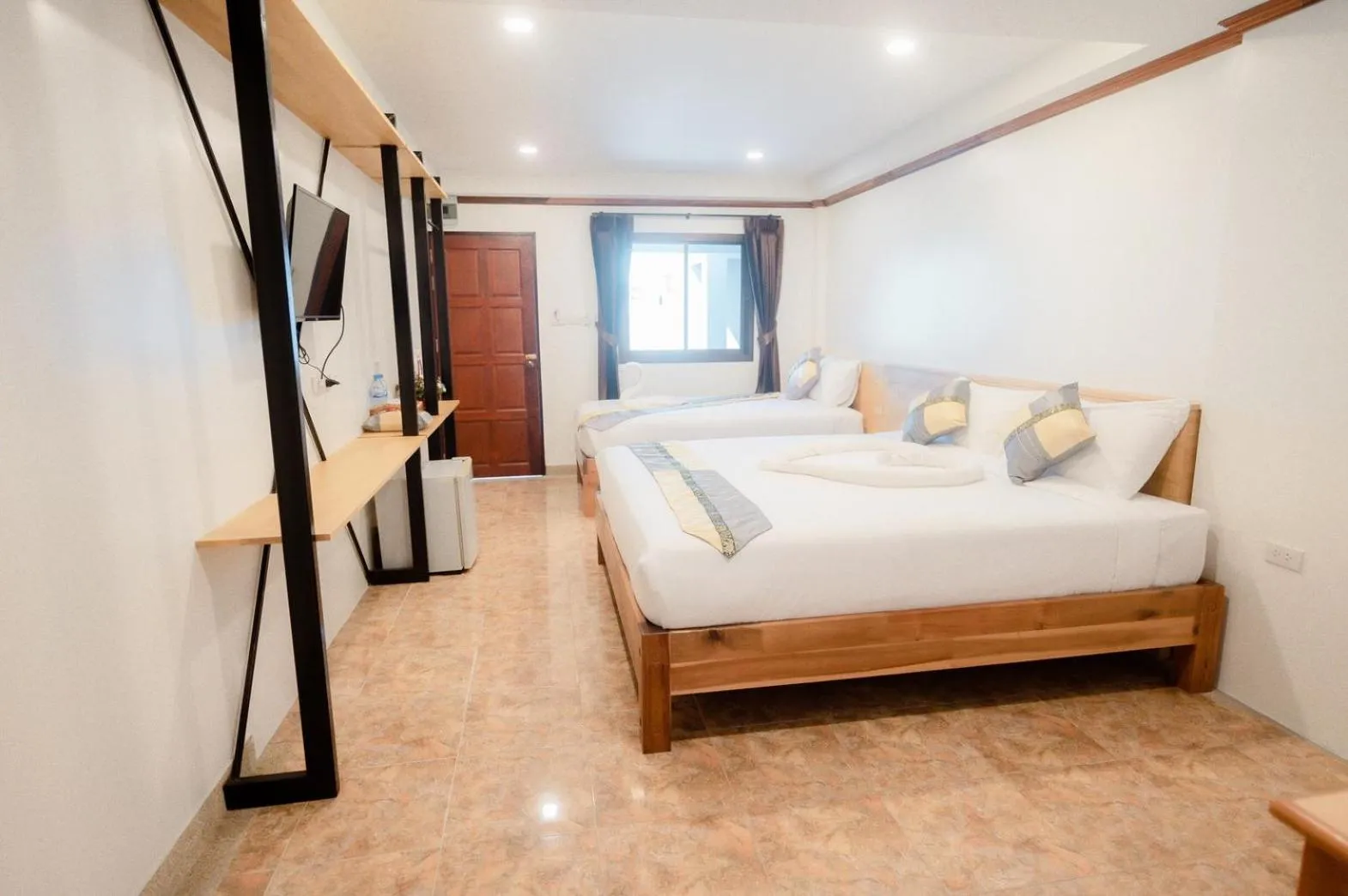 Bed in Coconut Grove Hotel Samui