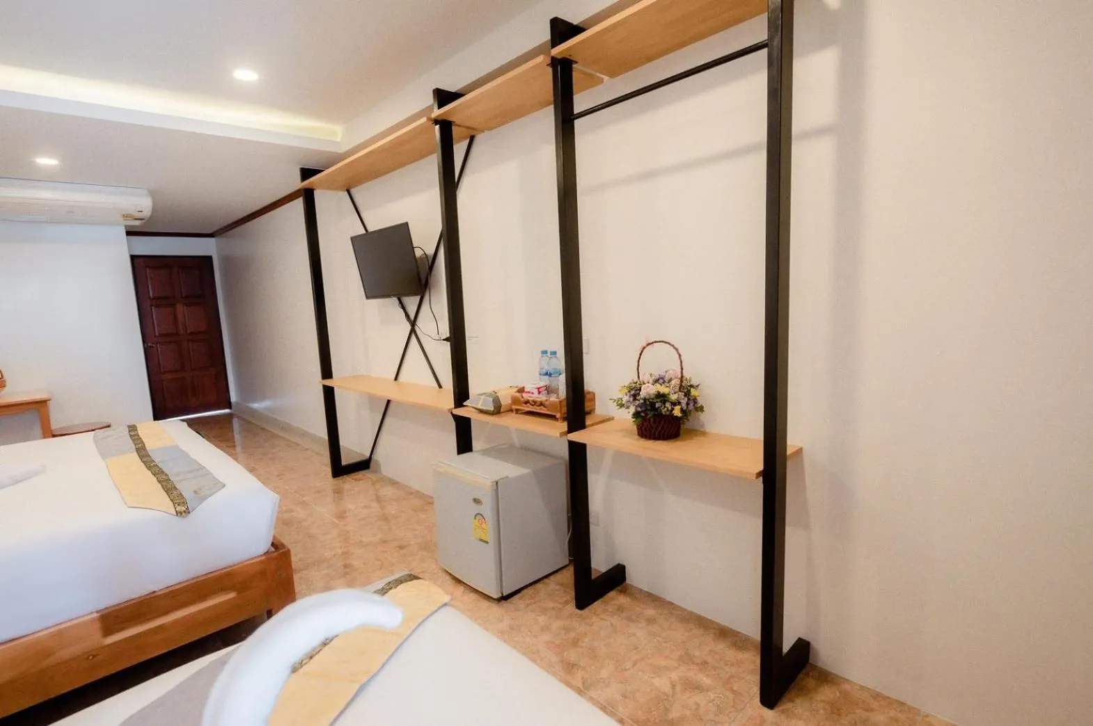 Bed in Coconut Grove Hotel Samui