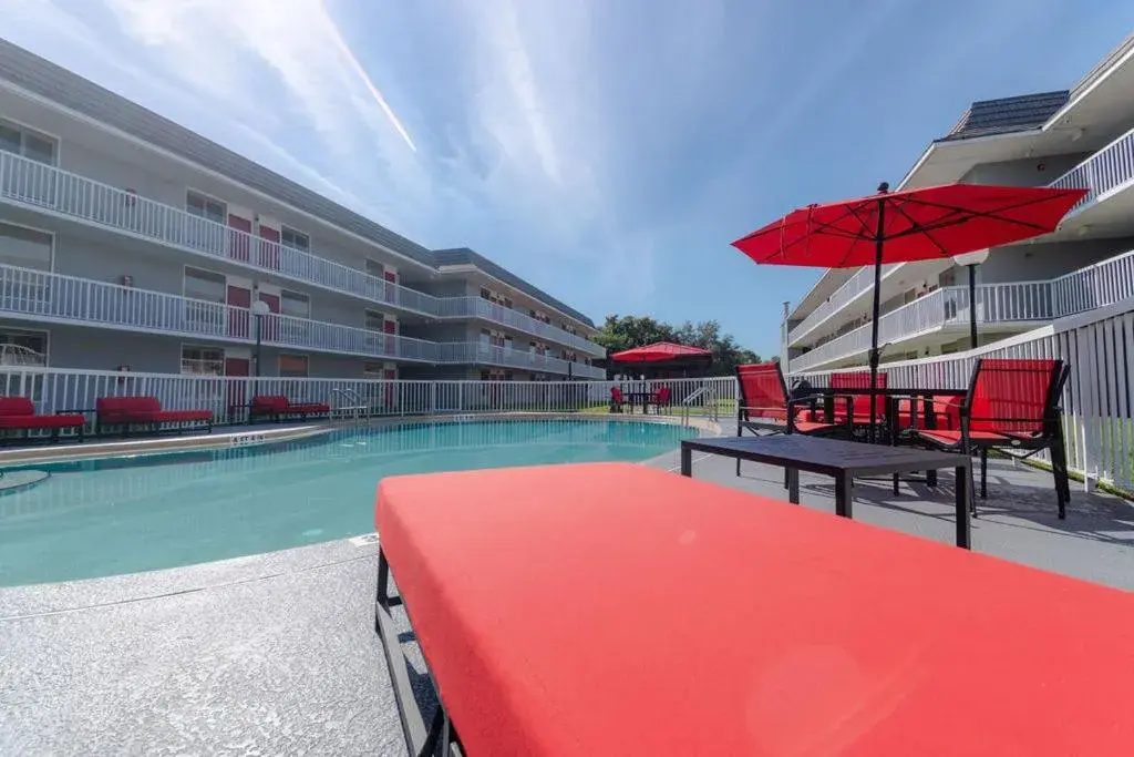 Property building, Swimming Pool in The Equus Inn & Suites Ocala