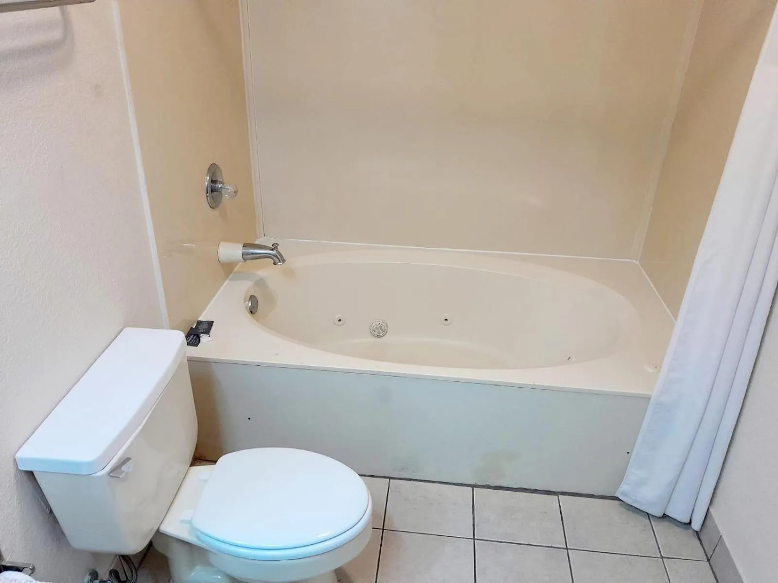 Toilet in Budgetel Inn and Suites- FORT GORDON
