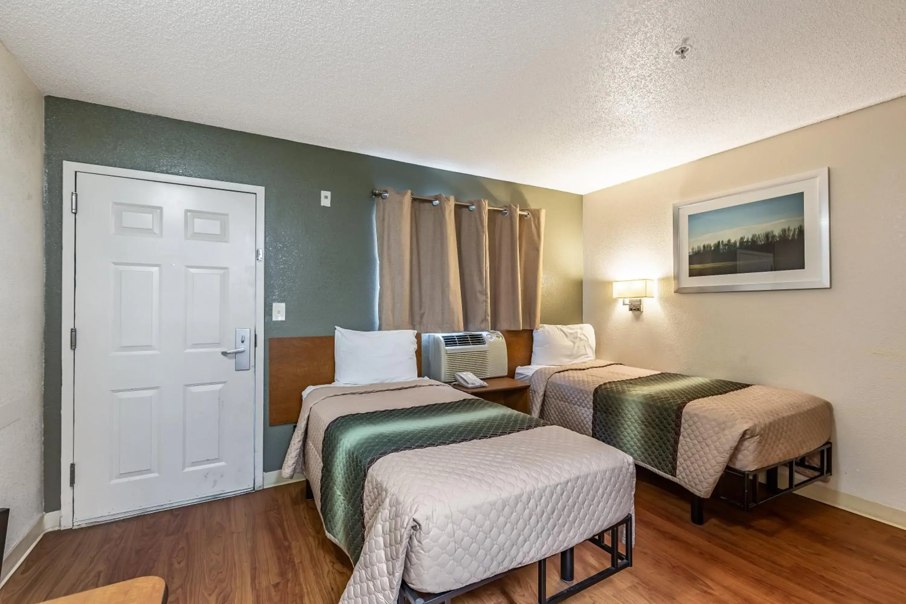 Bedroom, Bed in HomeTowne Studios by Red Roof Atlanta - Chamblee Bedroom, Bed in HomeTowne Studios by Red Roof Atlanta - Chamblee