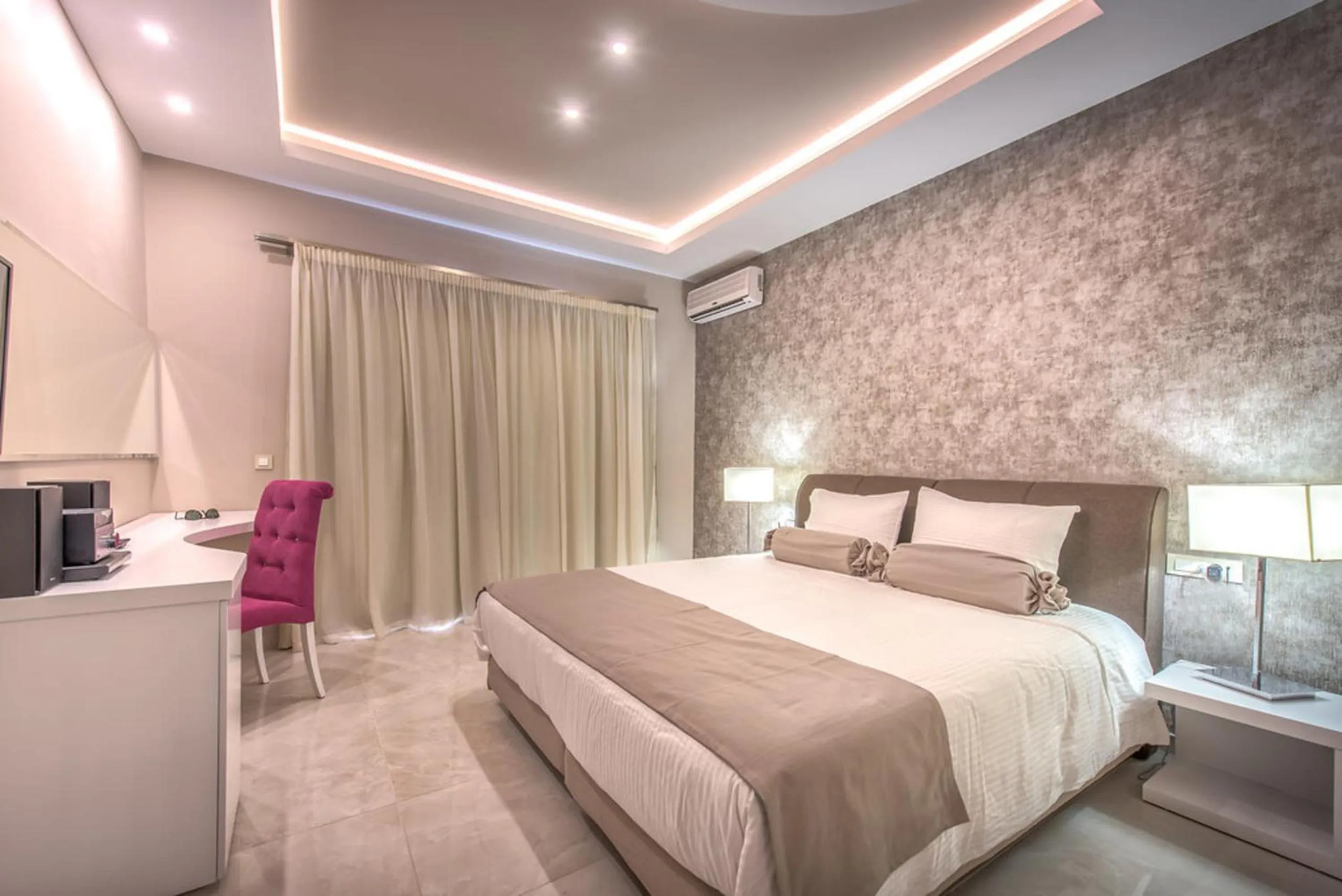 Bed in Koukounaria Hotel & Suites