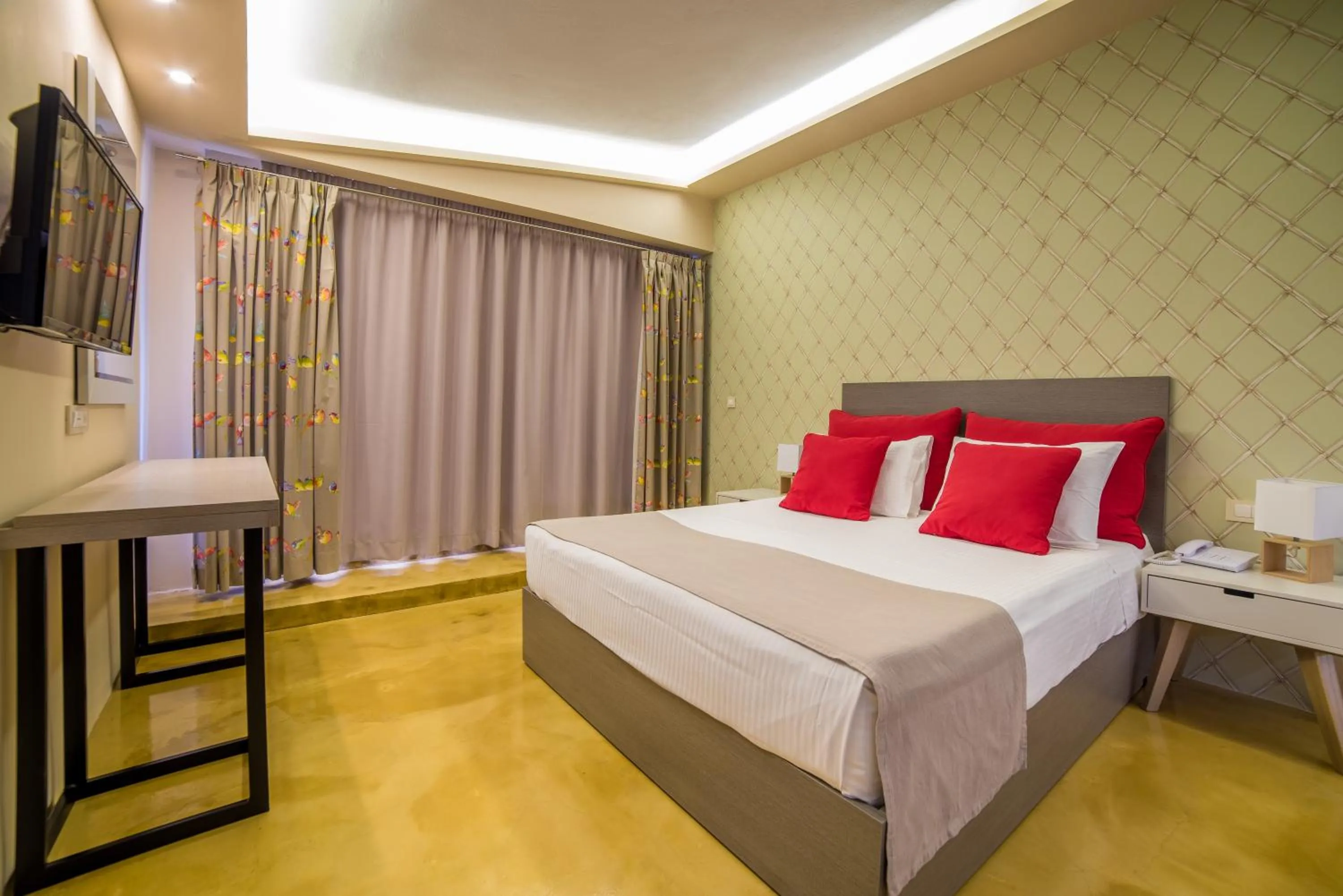 Bed in Koukounaria Hotel & Suites
