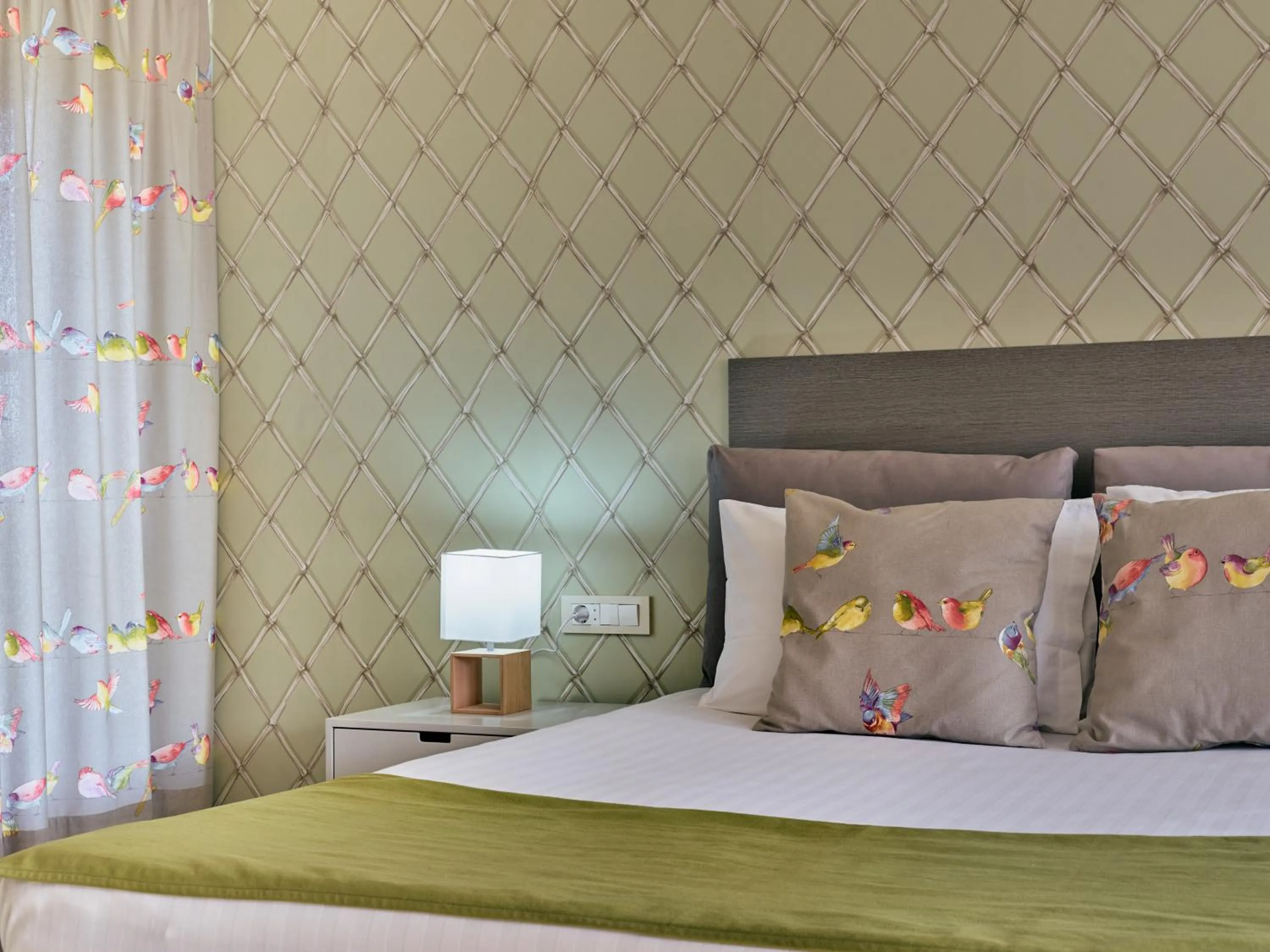 Bed in Koukounaria Hotel & Suites