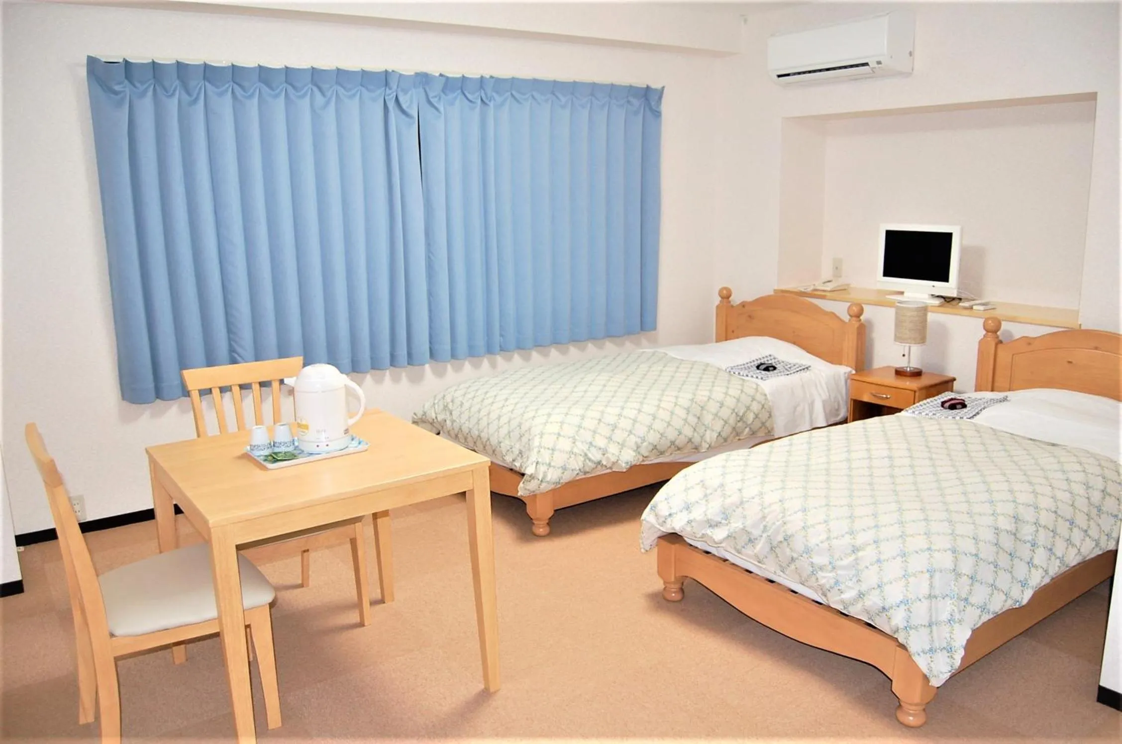 Bed in Ito Station Hotel