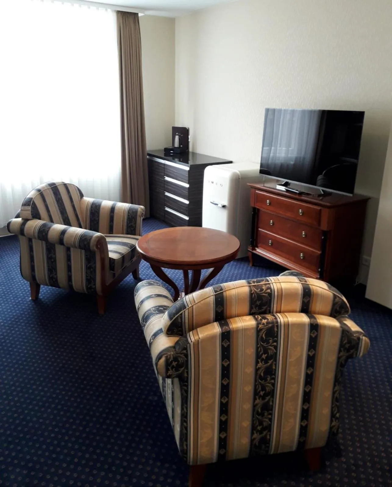 Communal lounge/ TV room in Fürstenhof Wernigerode Garni