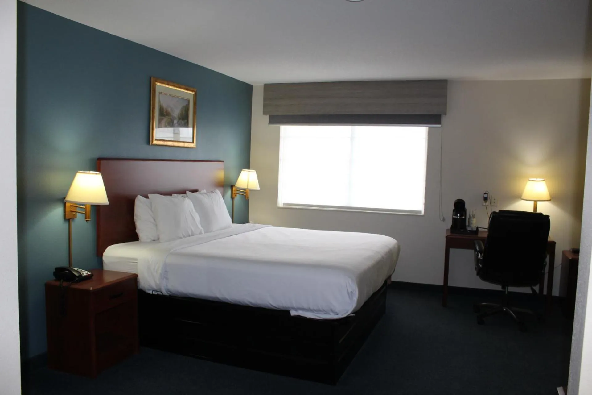 Bed in Reston Inn & Suites