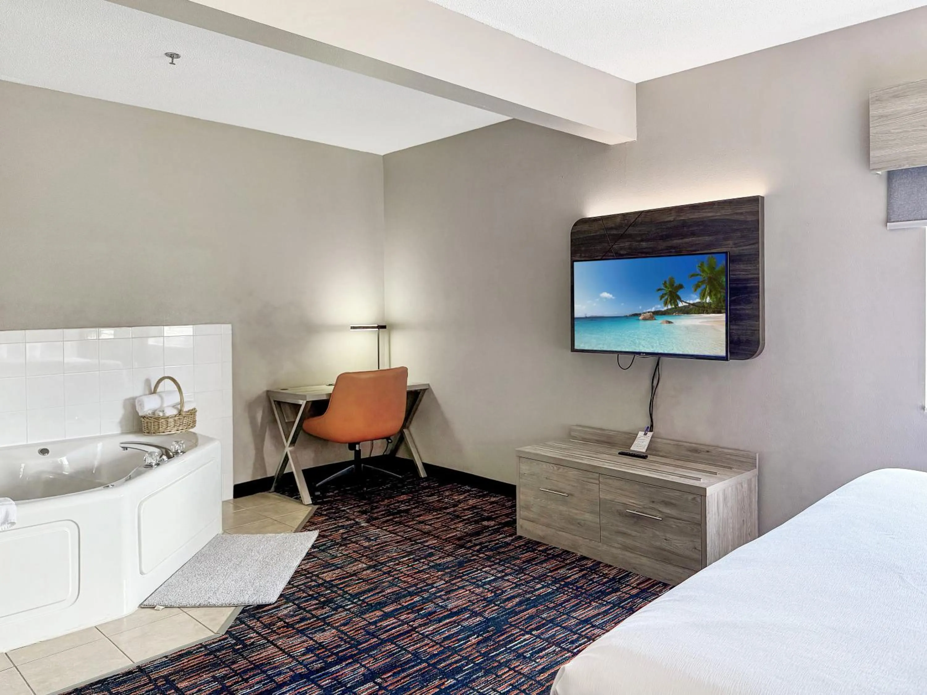 Bed in Reston Inn & Suites