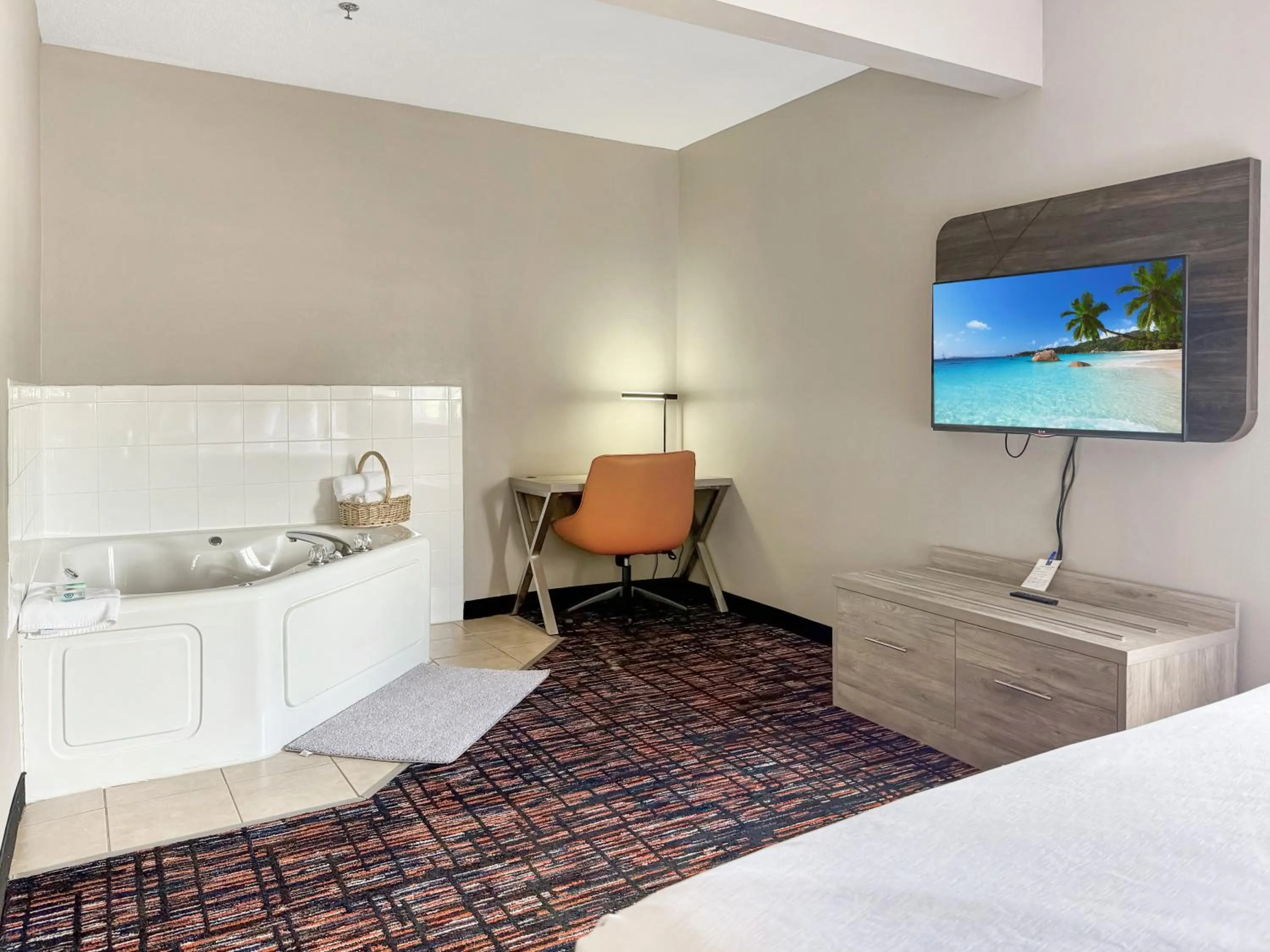 Bed in Reston Inn & Suites