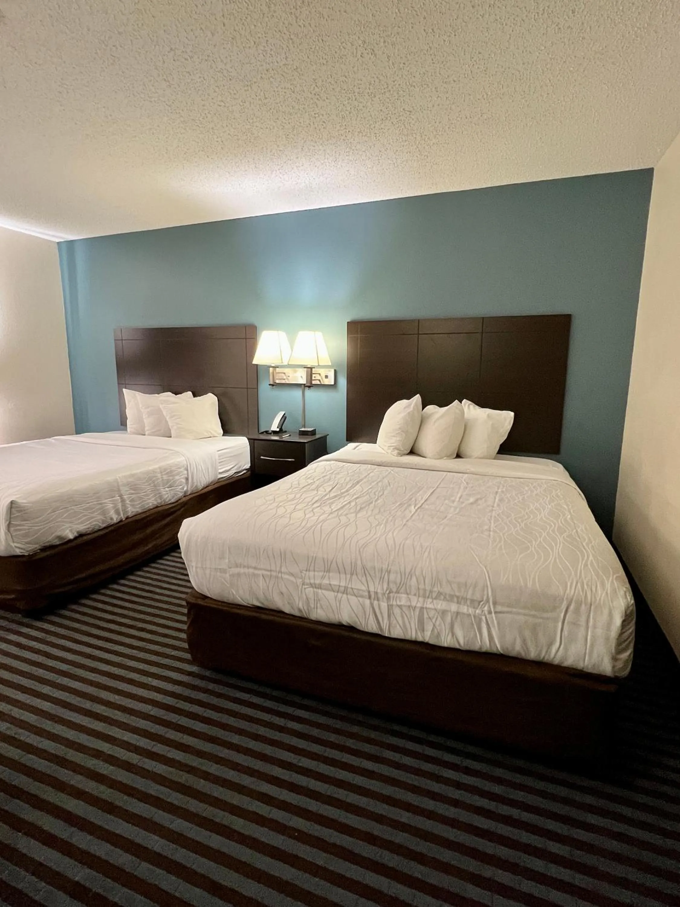 Bed in Reston Inn & Suites