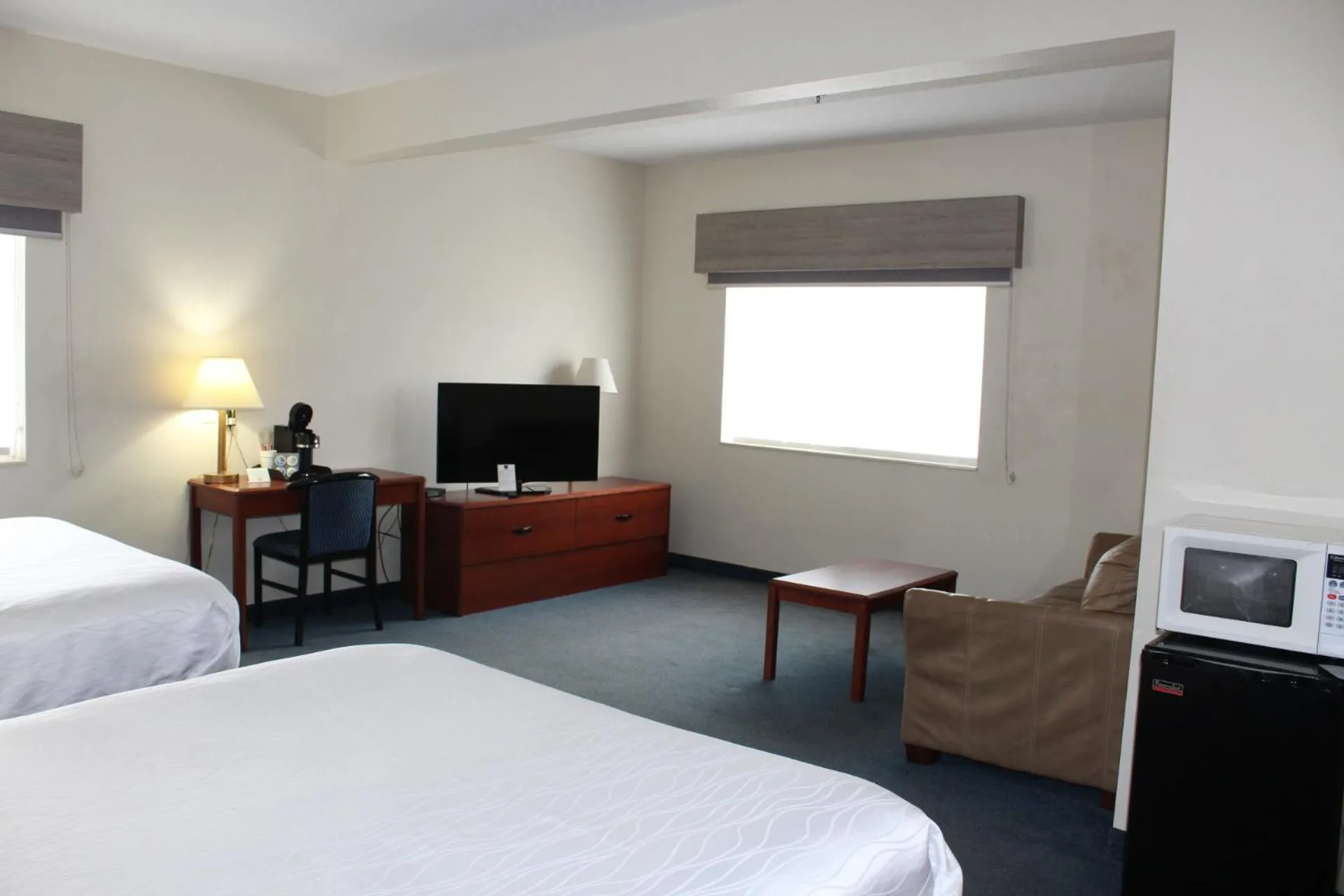 Bed in Reston Inn & Suites