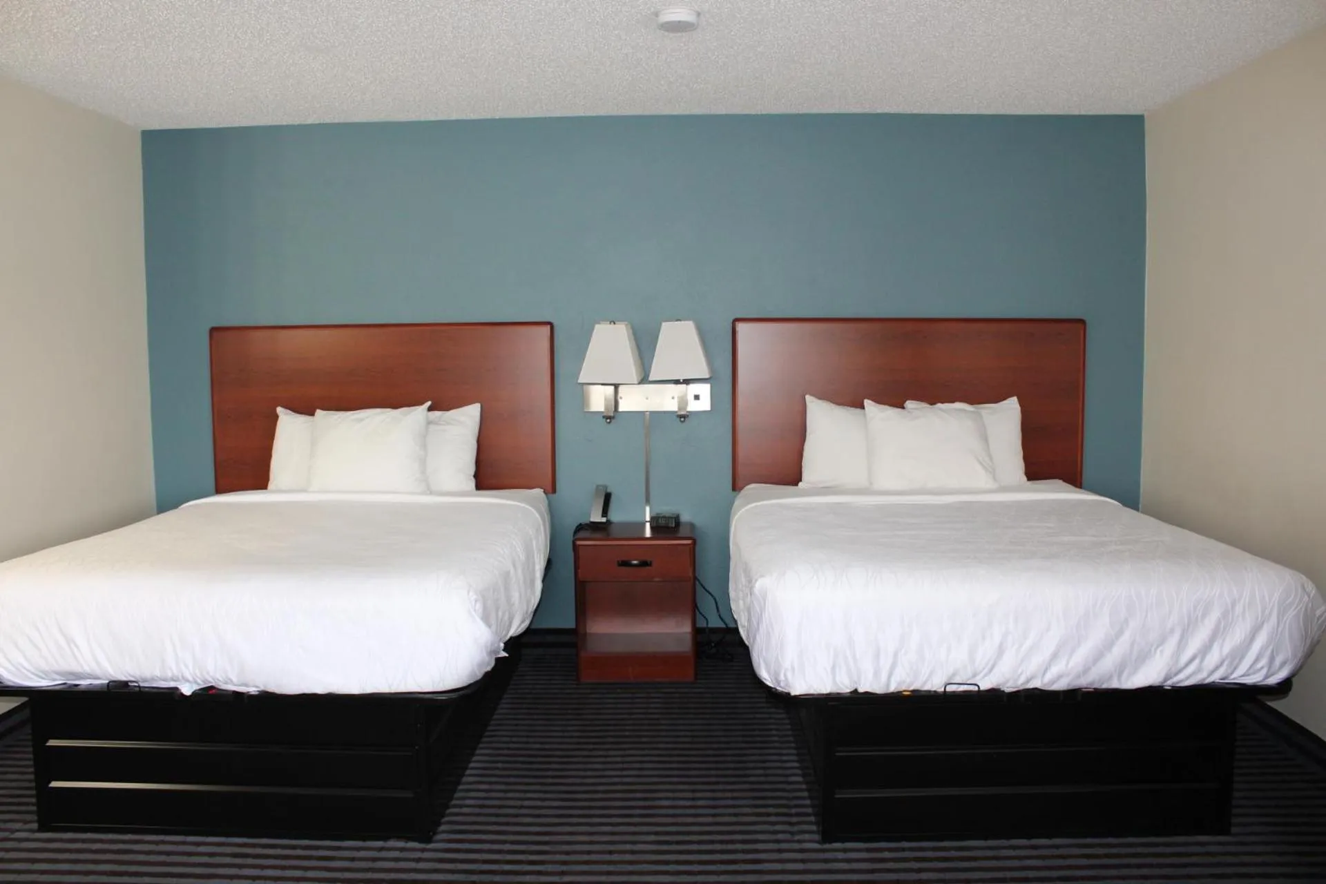 Bed in Reston Inn & Suites