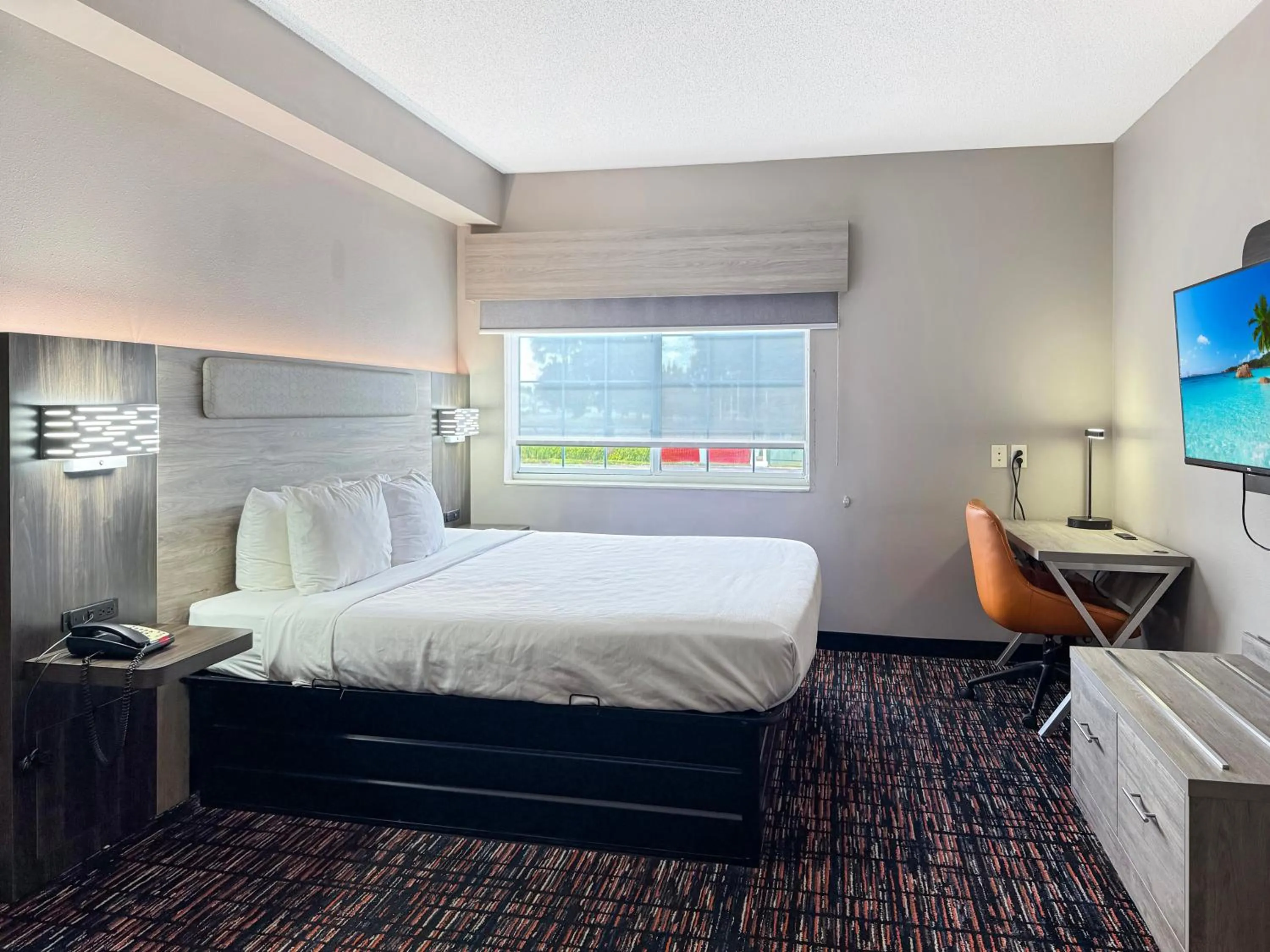 Bed in Reston Inn & Suites