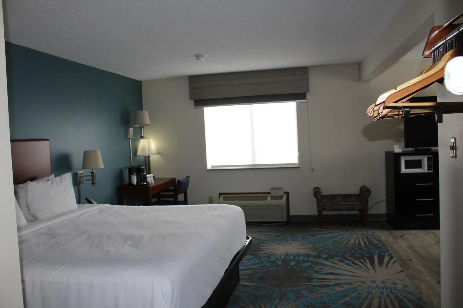 Bed in Reston Inn & Suites