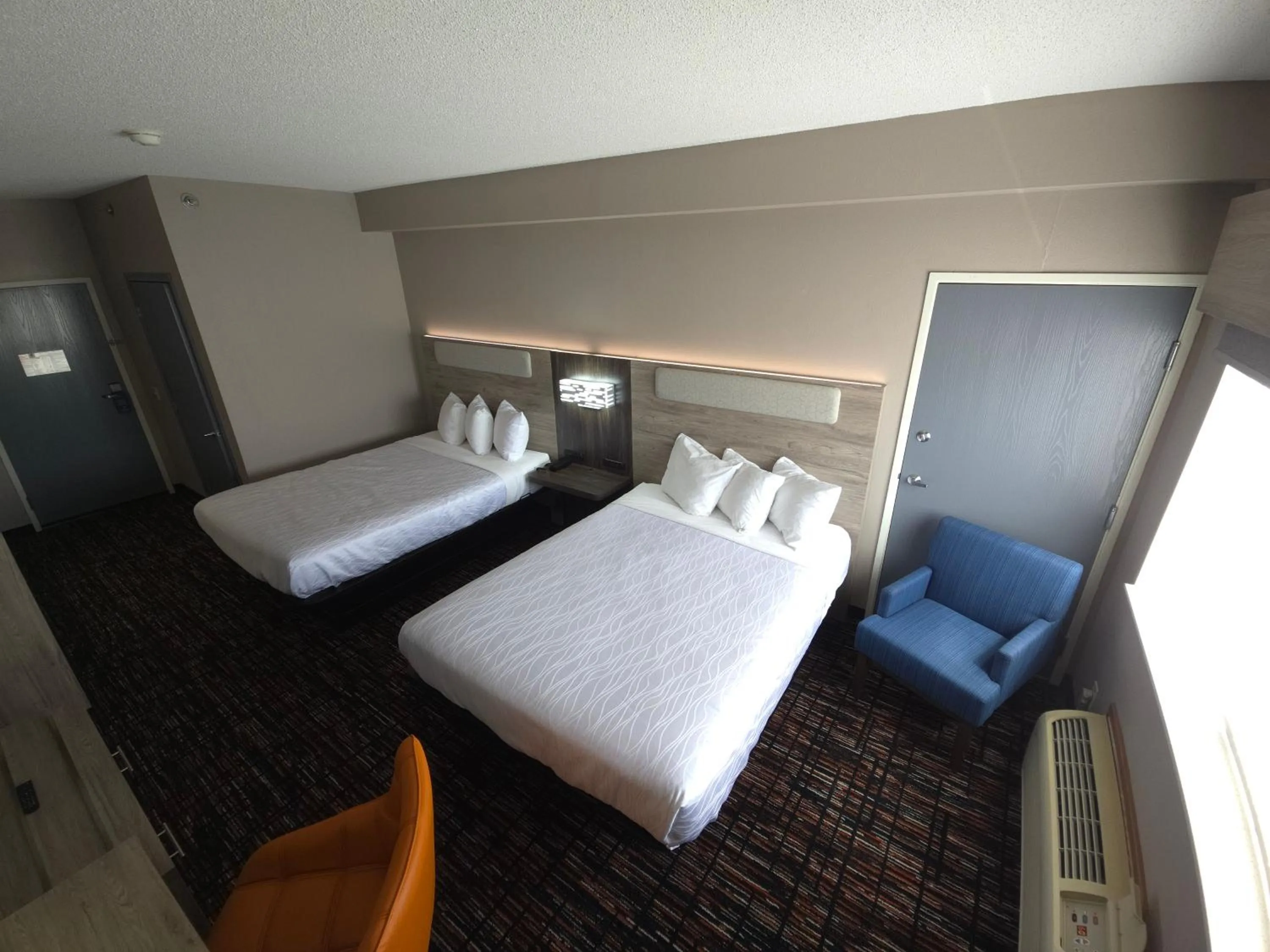 Bed in Reston Inn & Suites