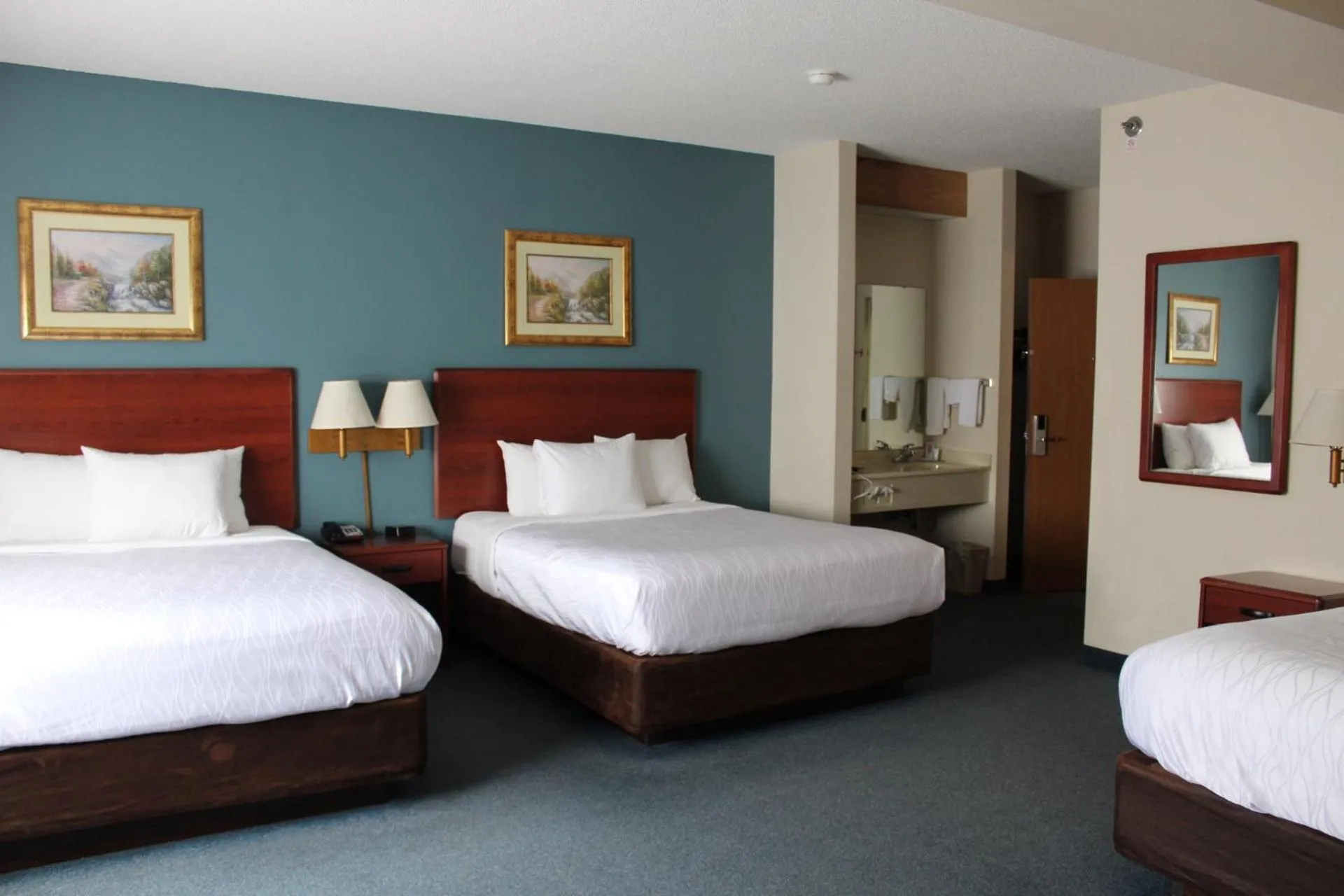 Bed in Reston Inn & Suites