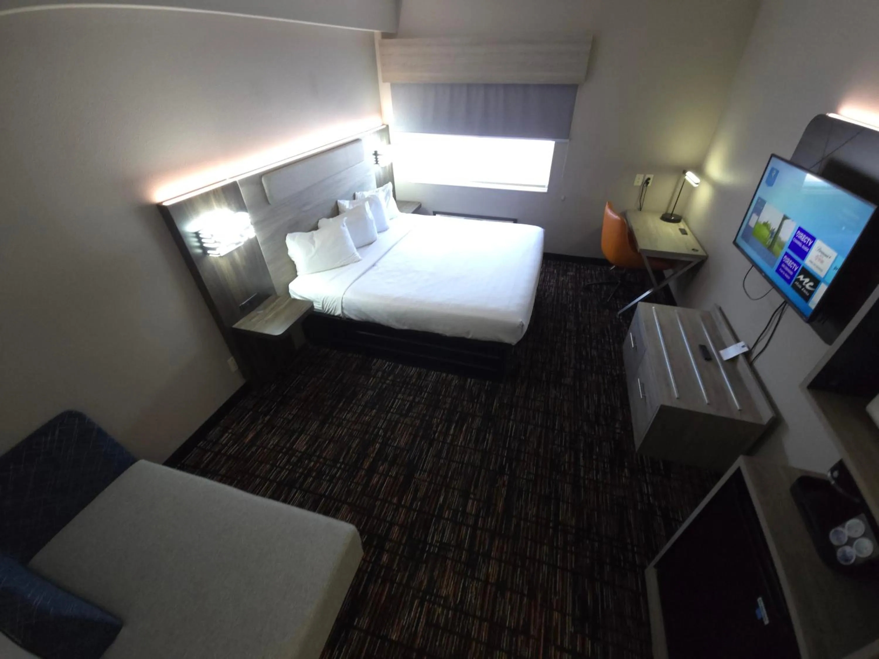 Bed in Reston Inn & Suites