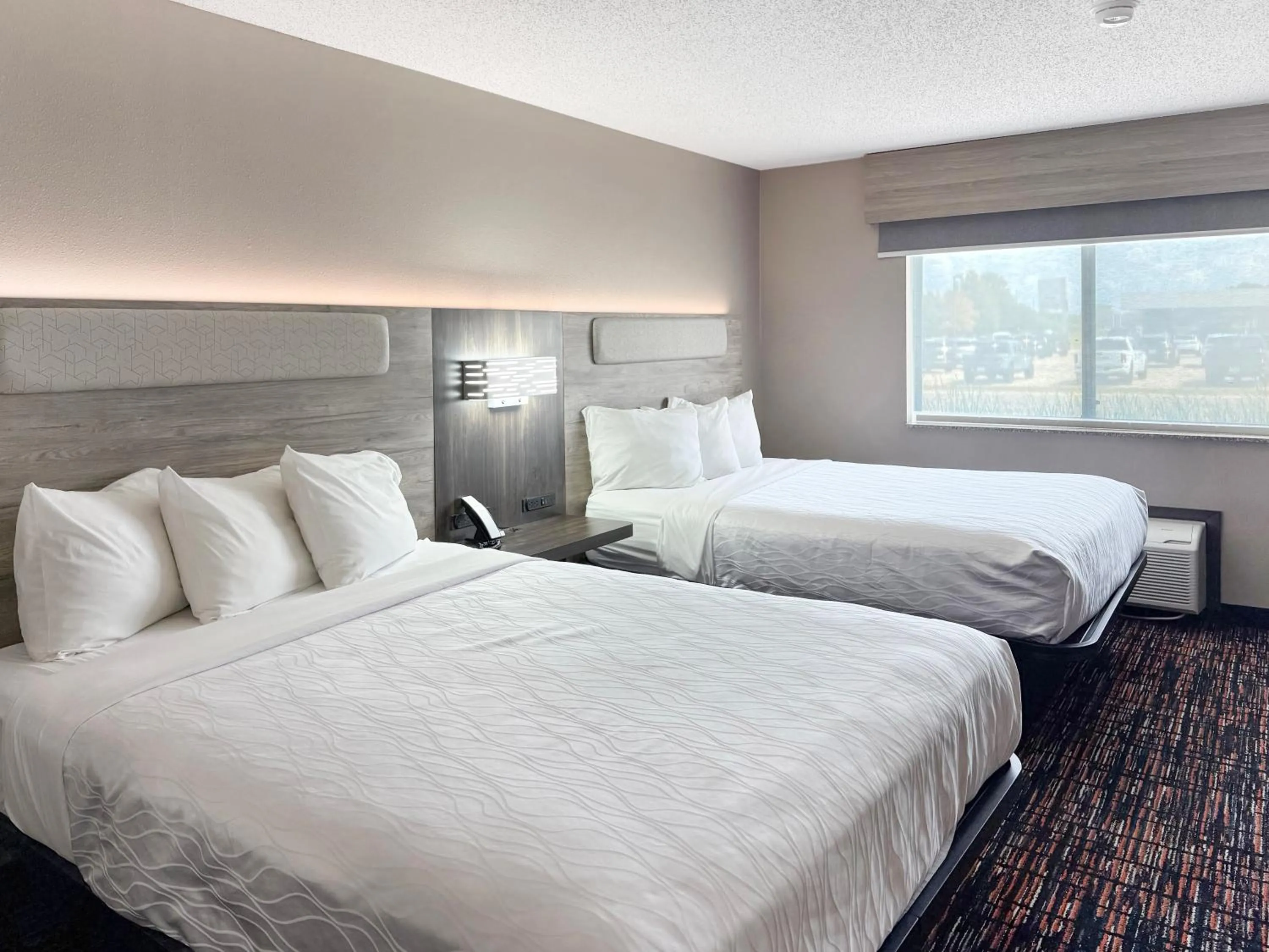 Bed in Reston Inn & Suites