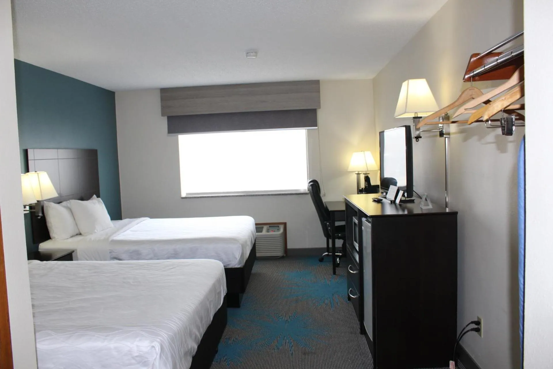 Bed in Reston Inn & Suites