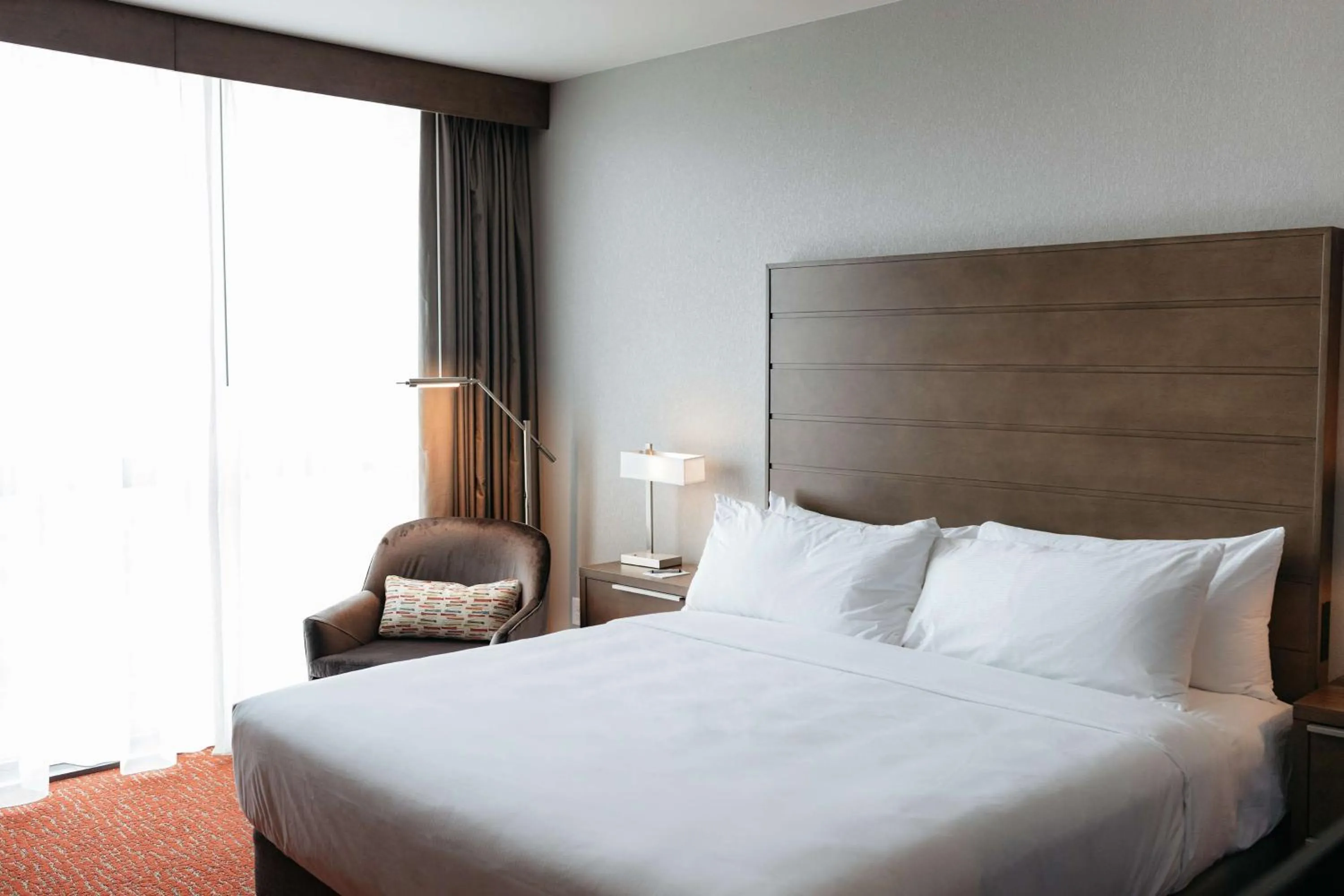 Living room, Bed in Revel Hotel, Tapestry Collection By Hilton