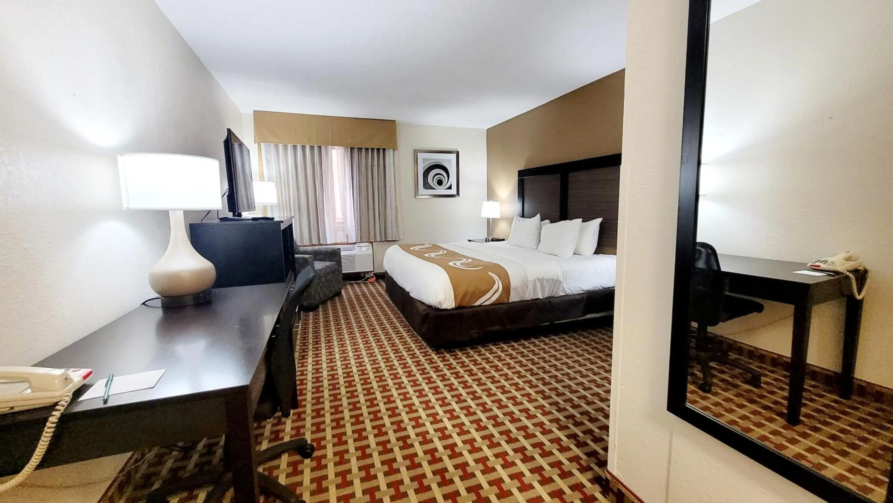 Bed in Quality Inn & Suites