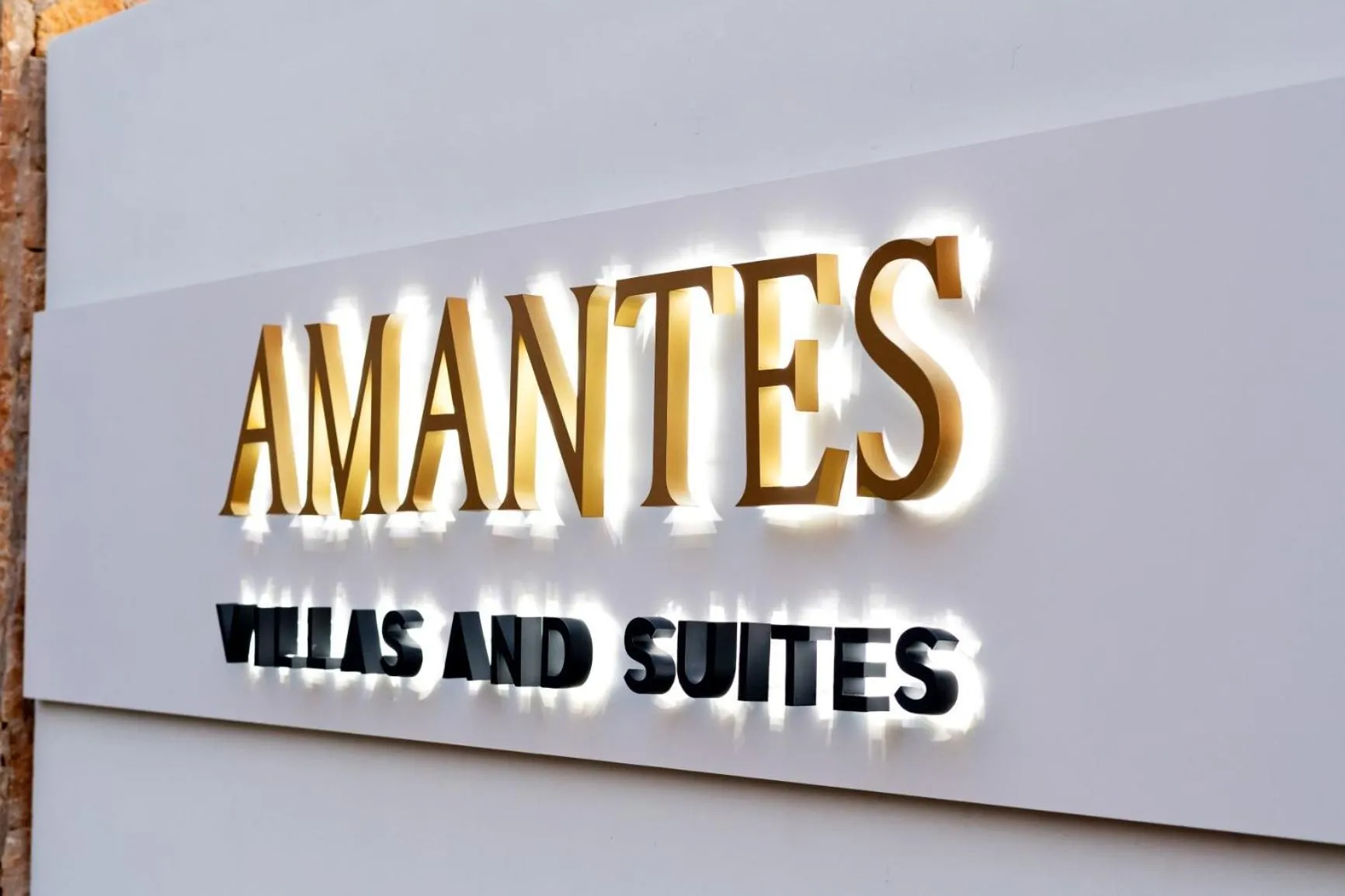 Property logo or sign in Amantes Villas and Suites