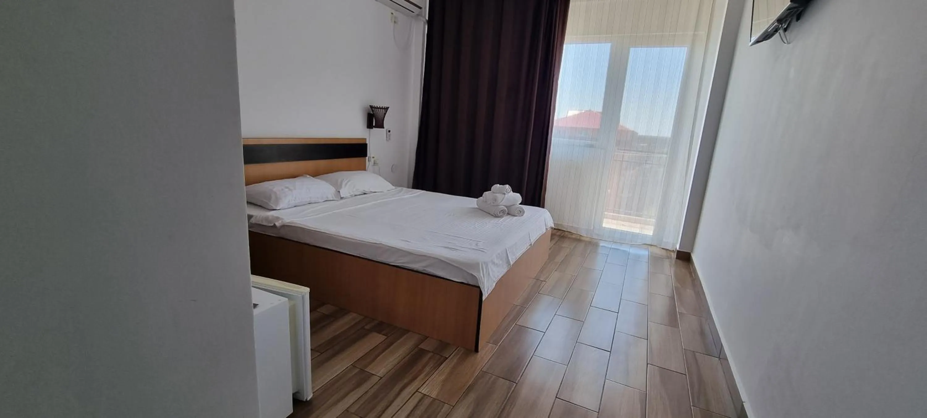 Bed in Hotel Blue Sky Resort