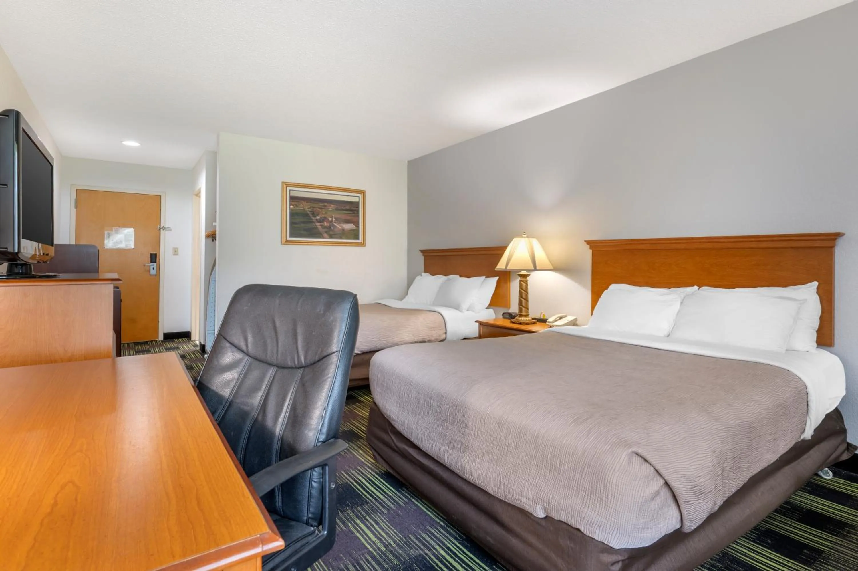 Bed in Quality Inn & Suites Near Amish Country