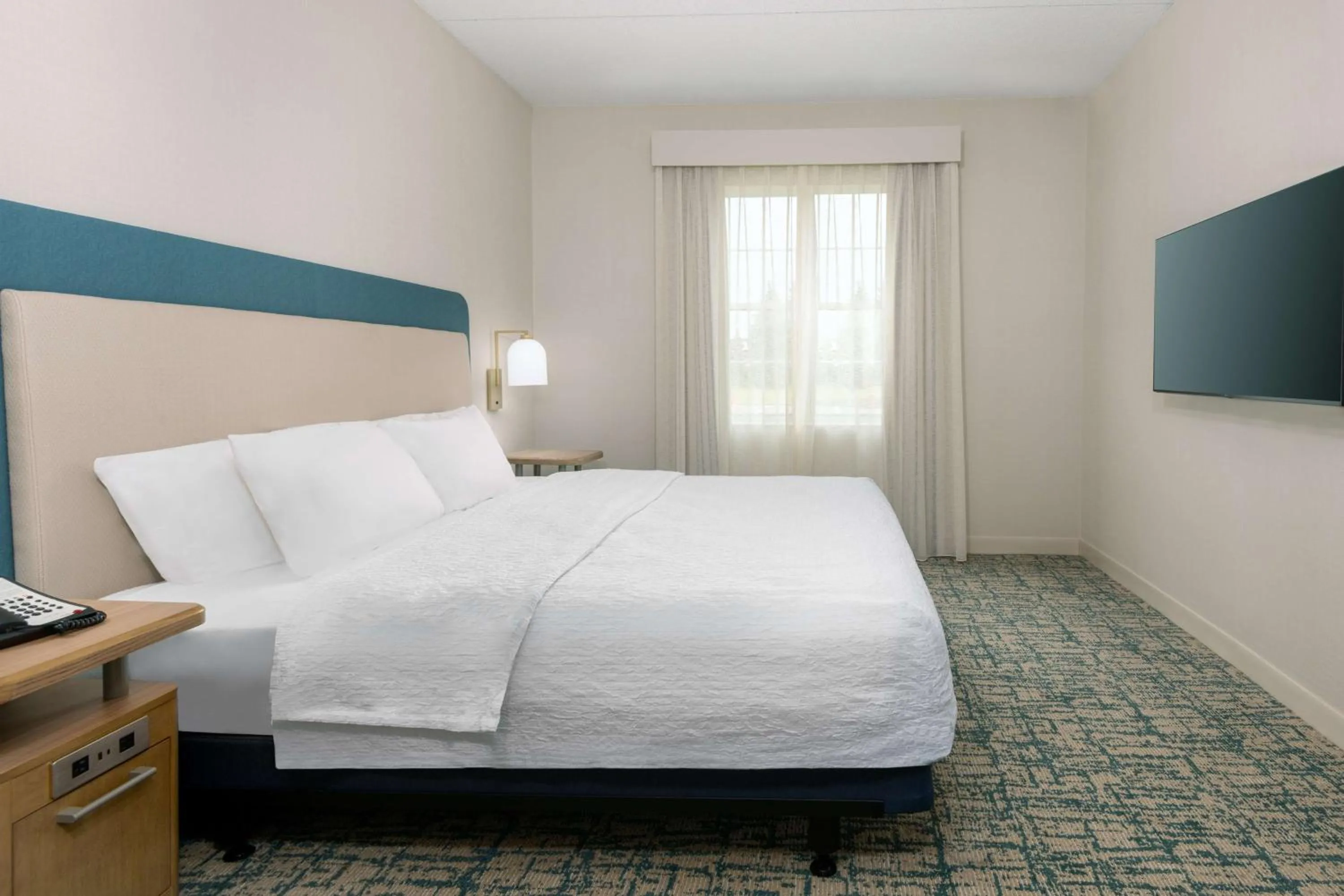 Bed in Homewood Suites by Hilton Buffalo/Airport
