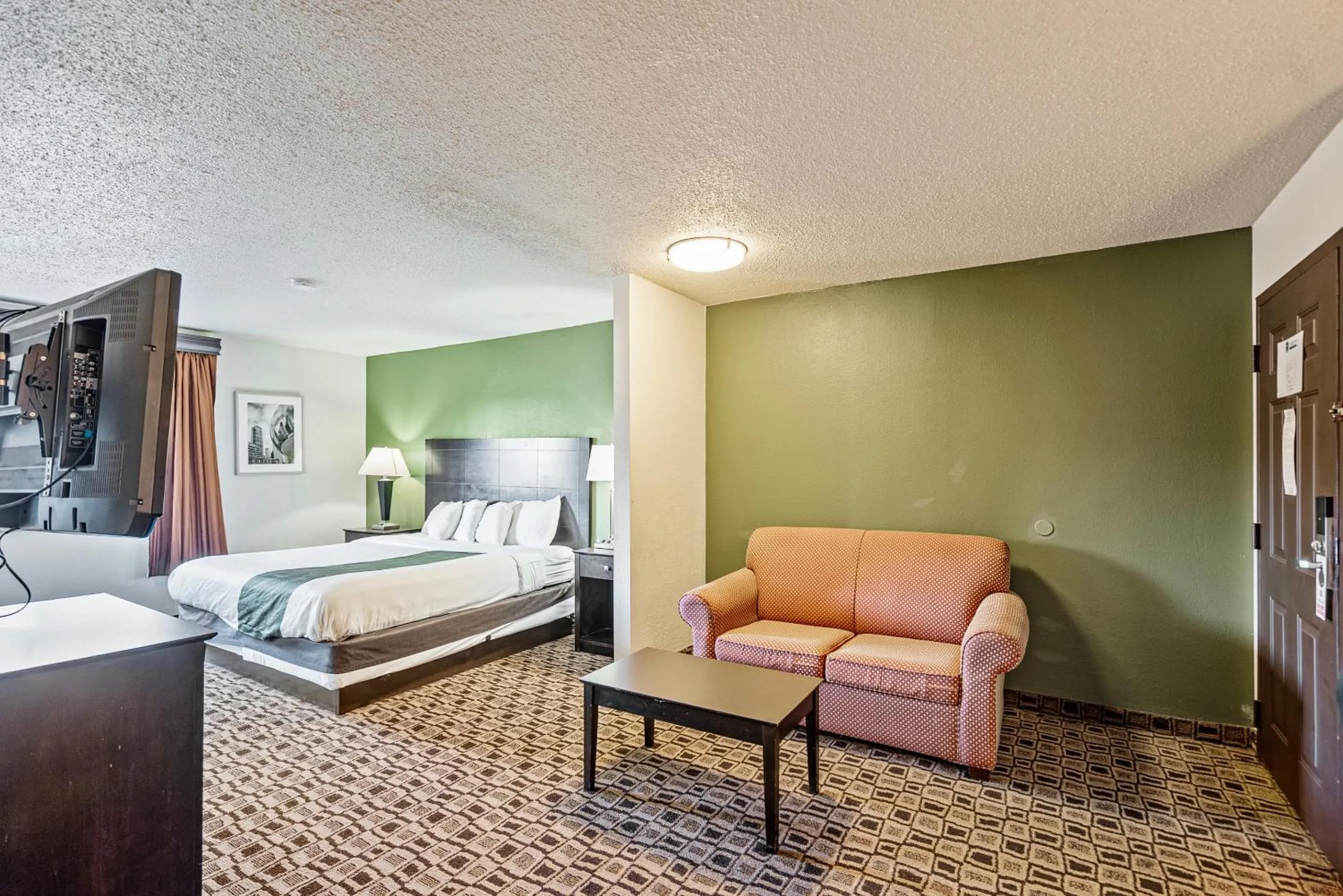 Bed in Coratel Plus Suites Wichita West Airport