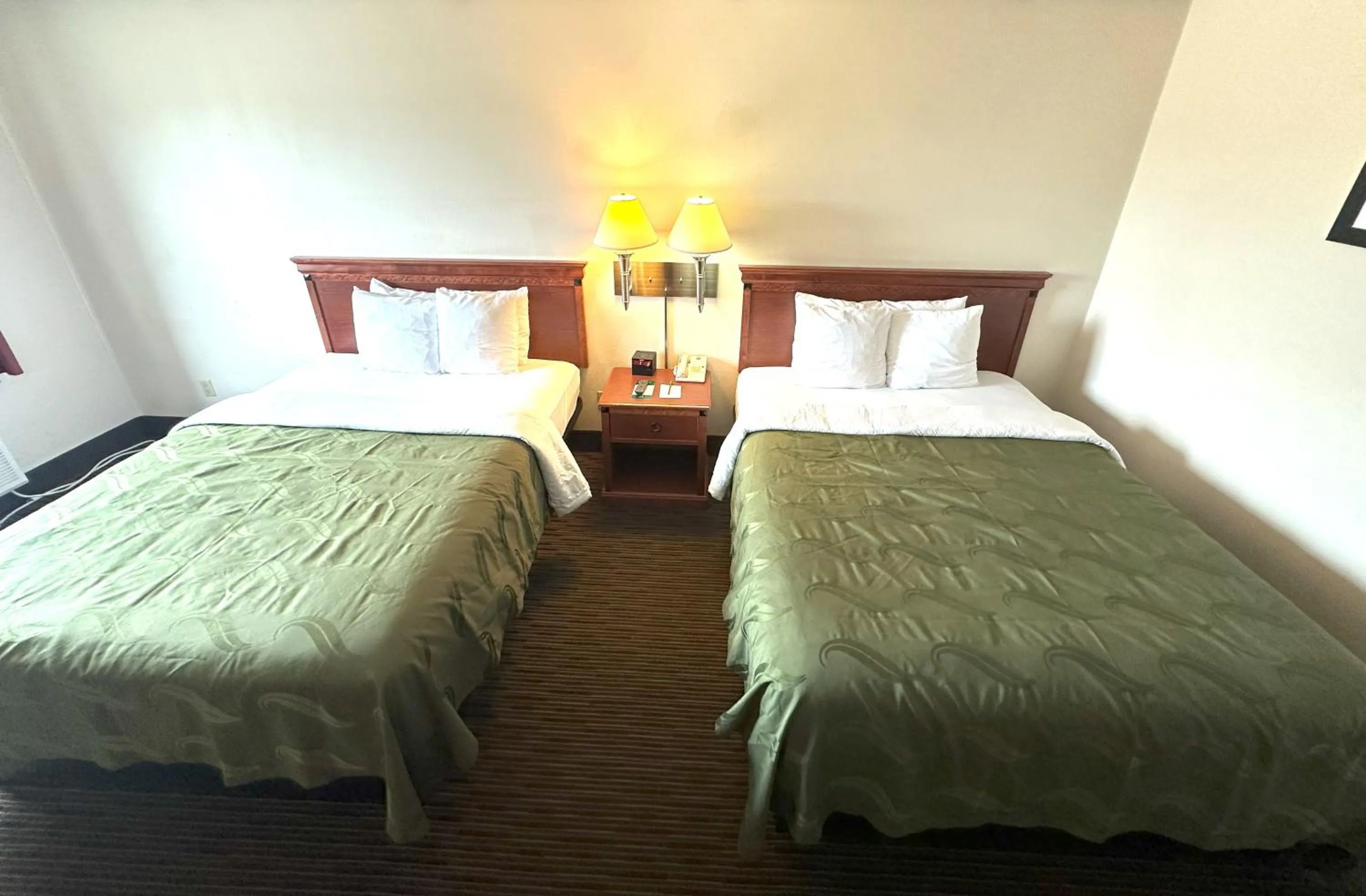 Bed in Quality Inn & Suites Salina West