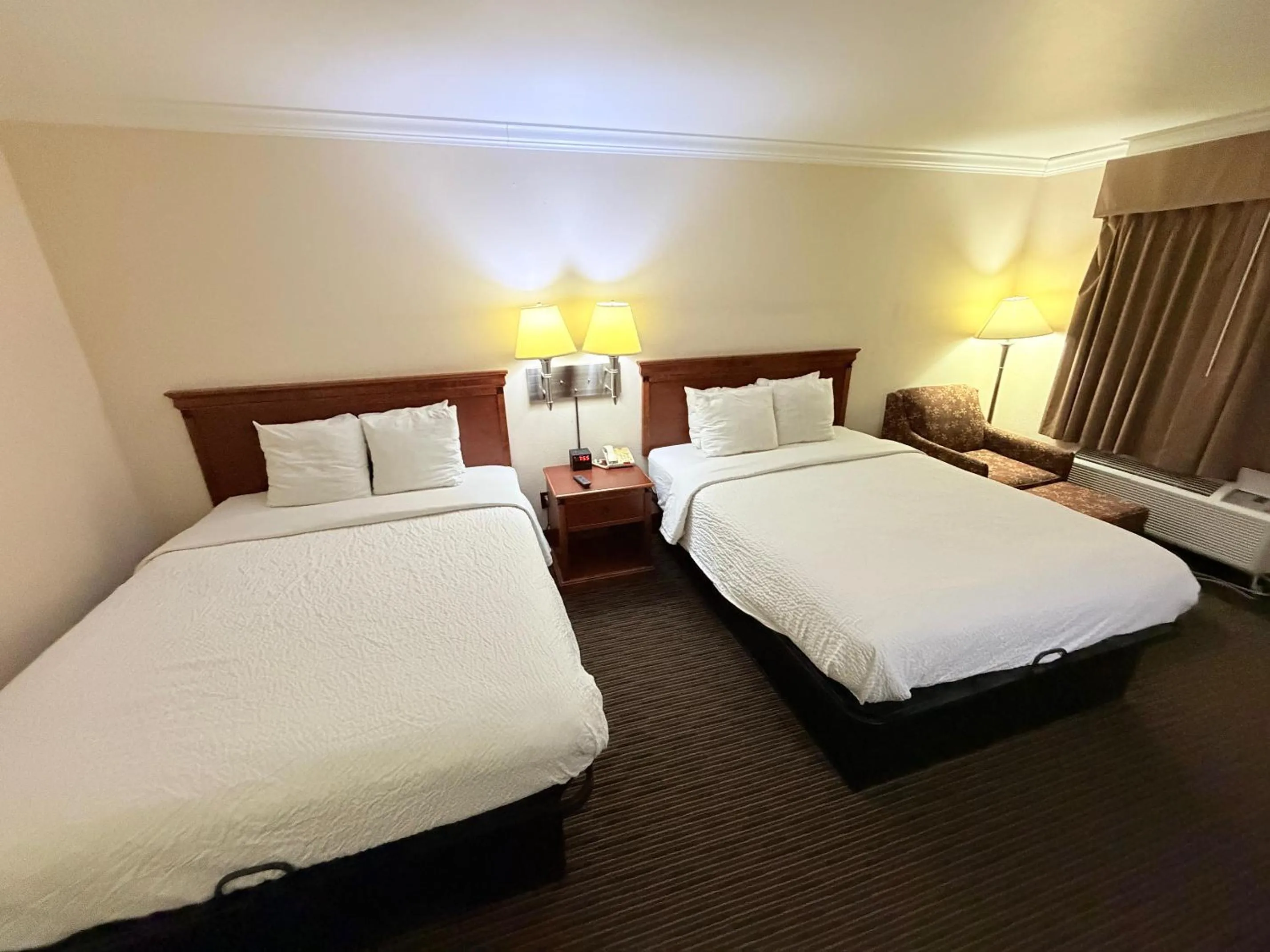 Bedroom, Bed in Sunflower Inn & Suites