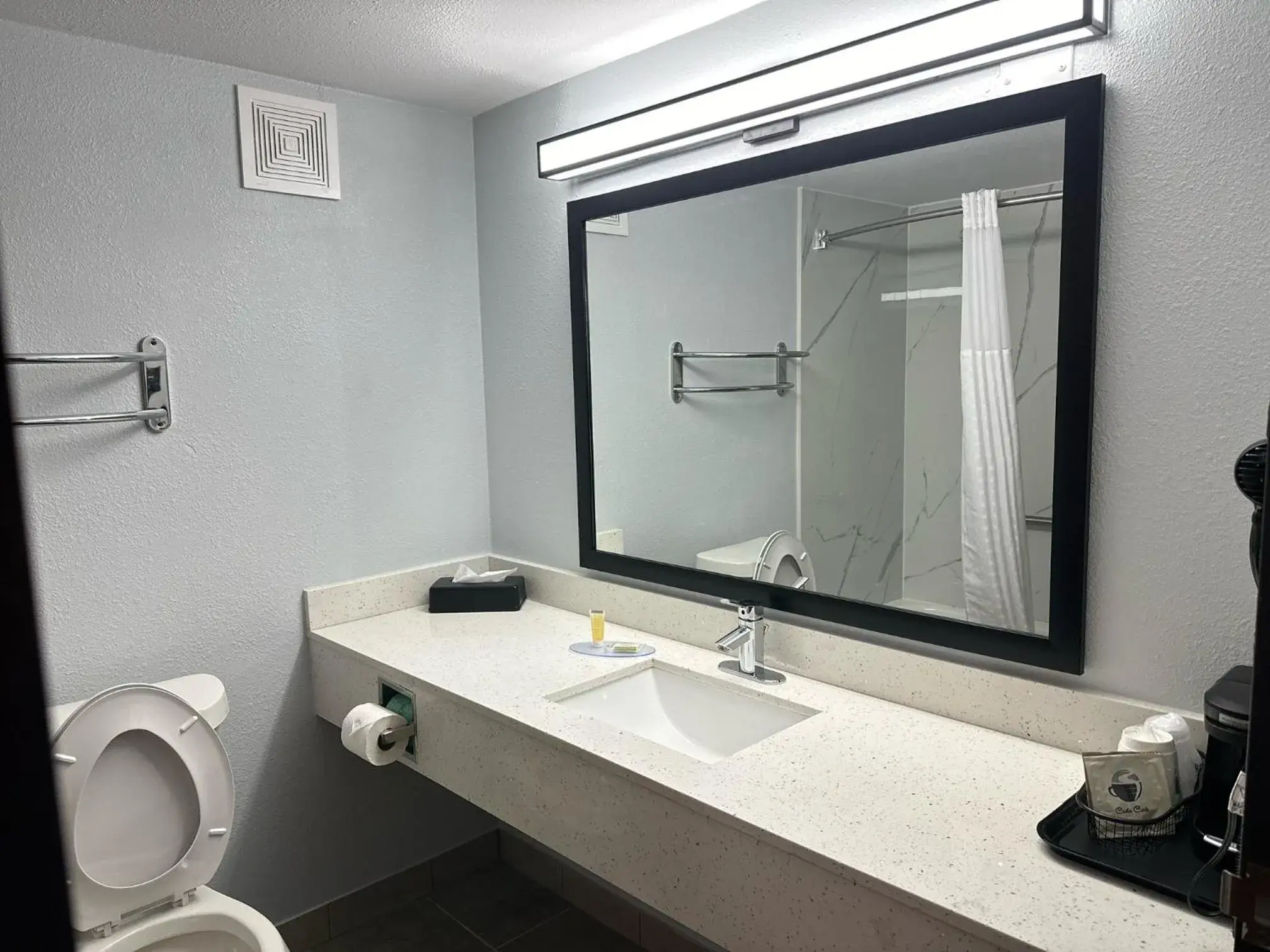 Bathroom in Super 8 by Wyndham Alexandria LA