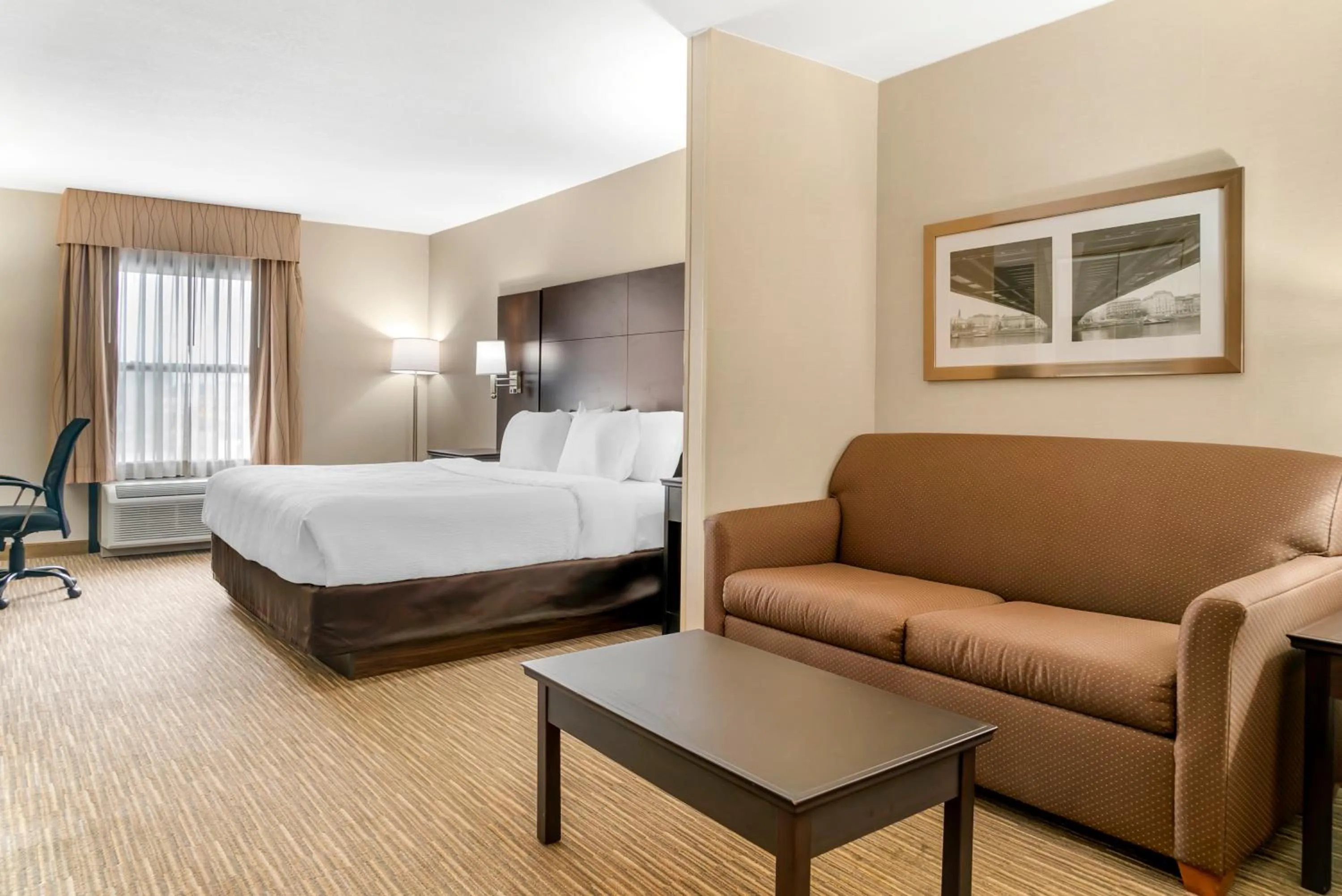 Bed in Quality Inn & Suites Monroe