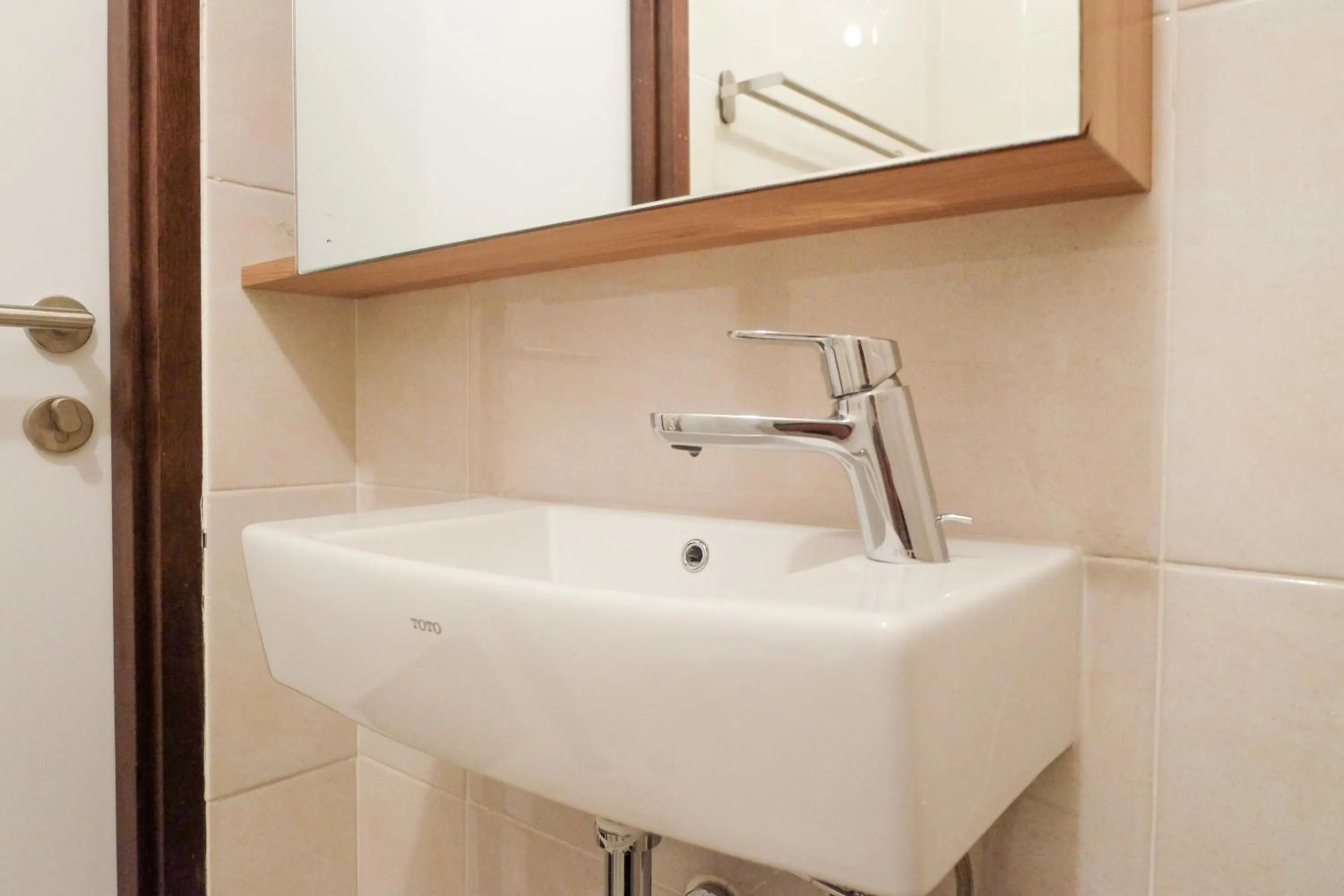 Bathroom in Modern Apartment Studio No Kitchen Mustika Golf Residence By Travelio